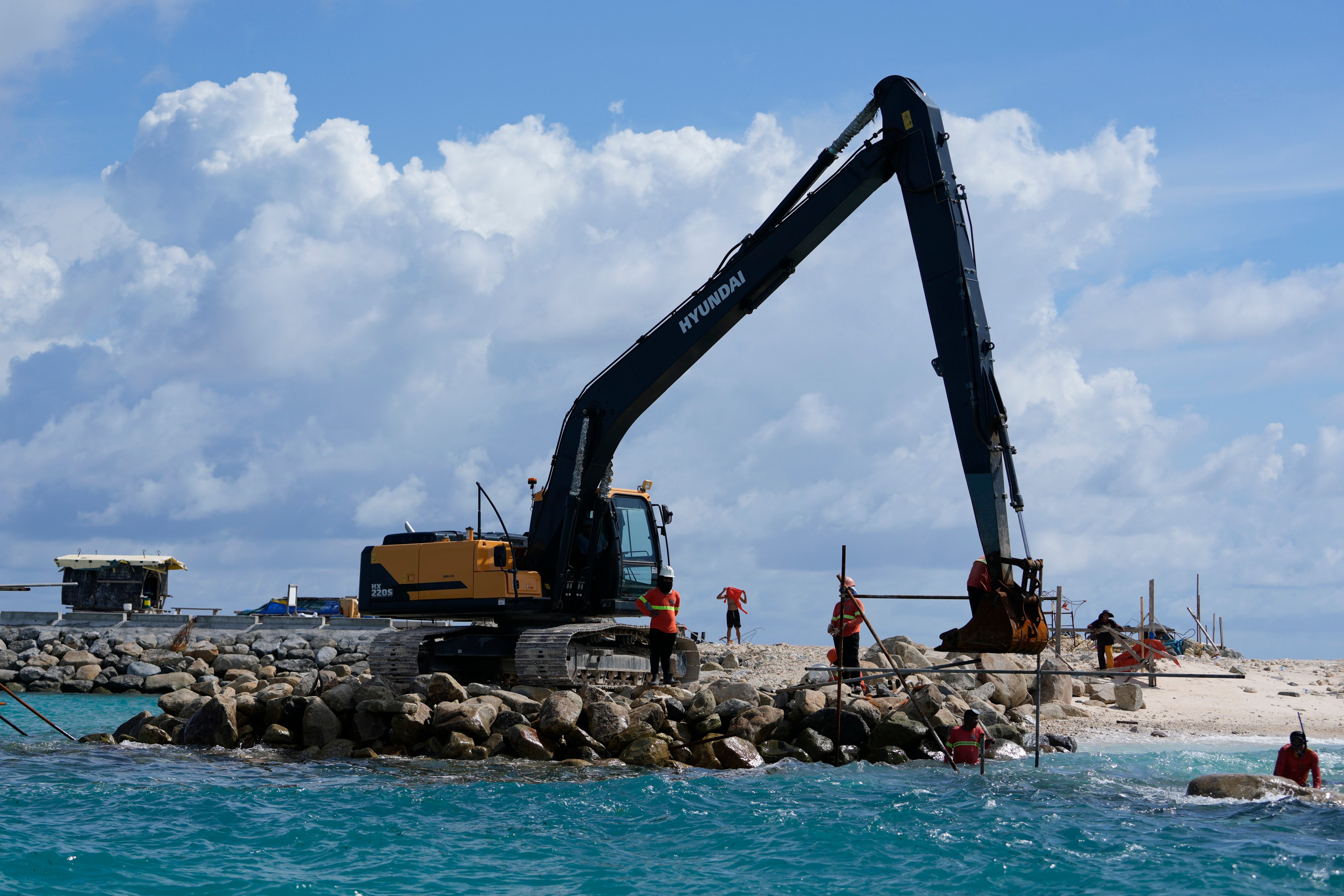 Construction takes place on the Philippine-occupied Thitu island, locally called Pagasa, in November 2024. Photo: AP