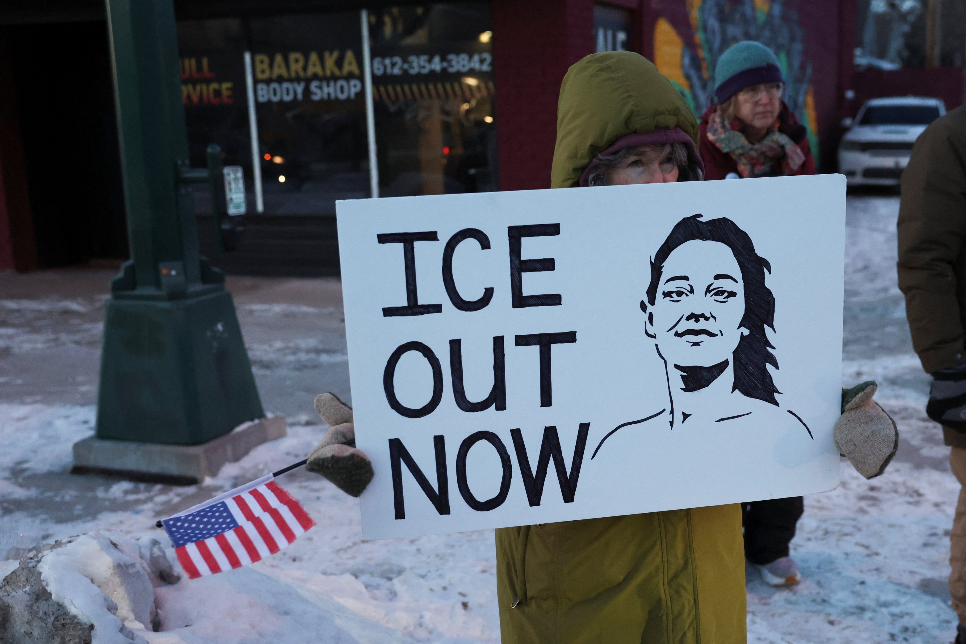 A demonstrator holds an illustration of Renee Good, who was fatally shot by a ICE agent on January 7, as people protest the presence of federal immigration agents in Minnesota, last month. Photo: Reuters