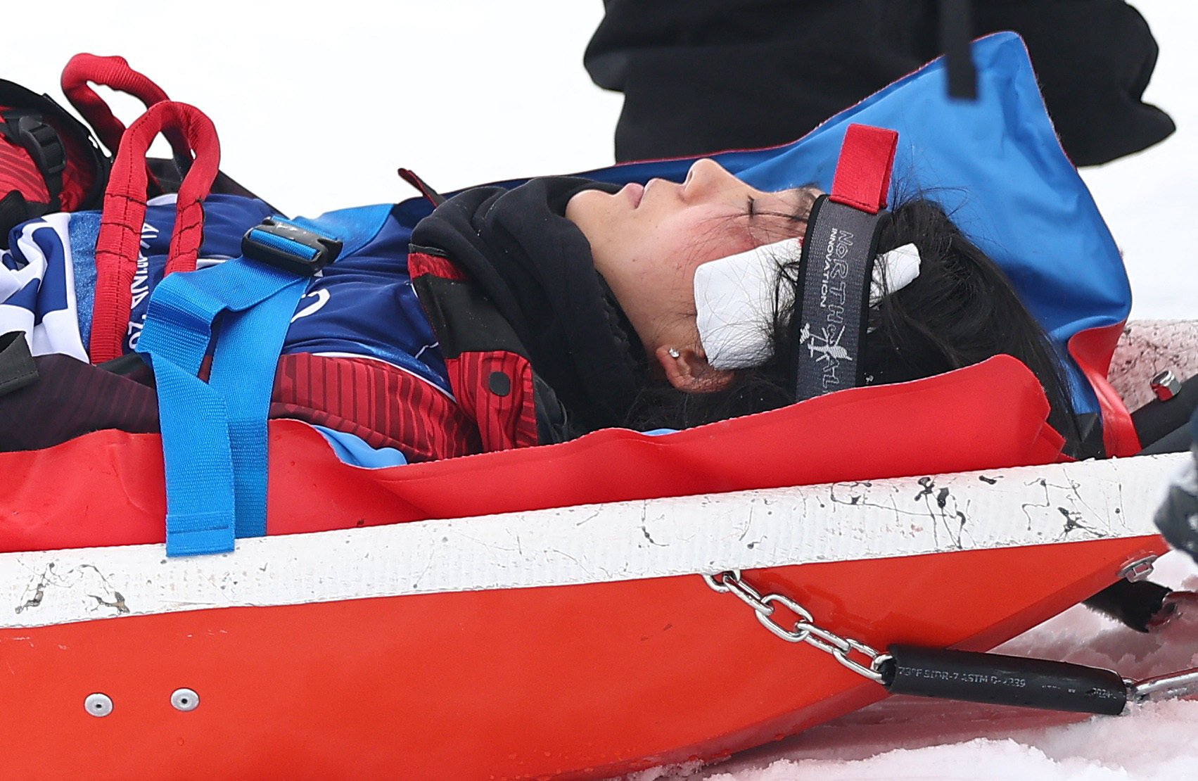 Liu Jiayu being taken off on a stretcher after sustaining an injury during a fall in competition on Wednesday. Photo: Reuters