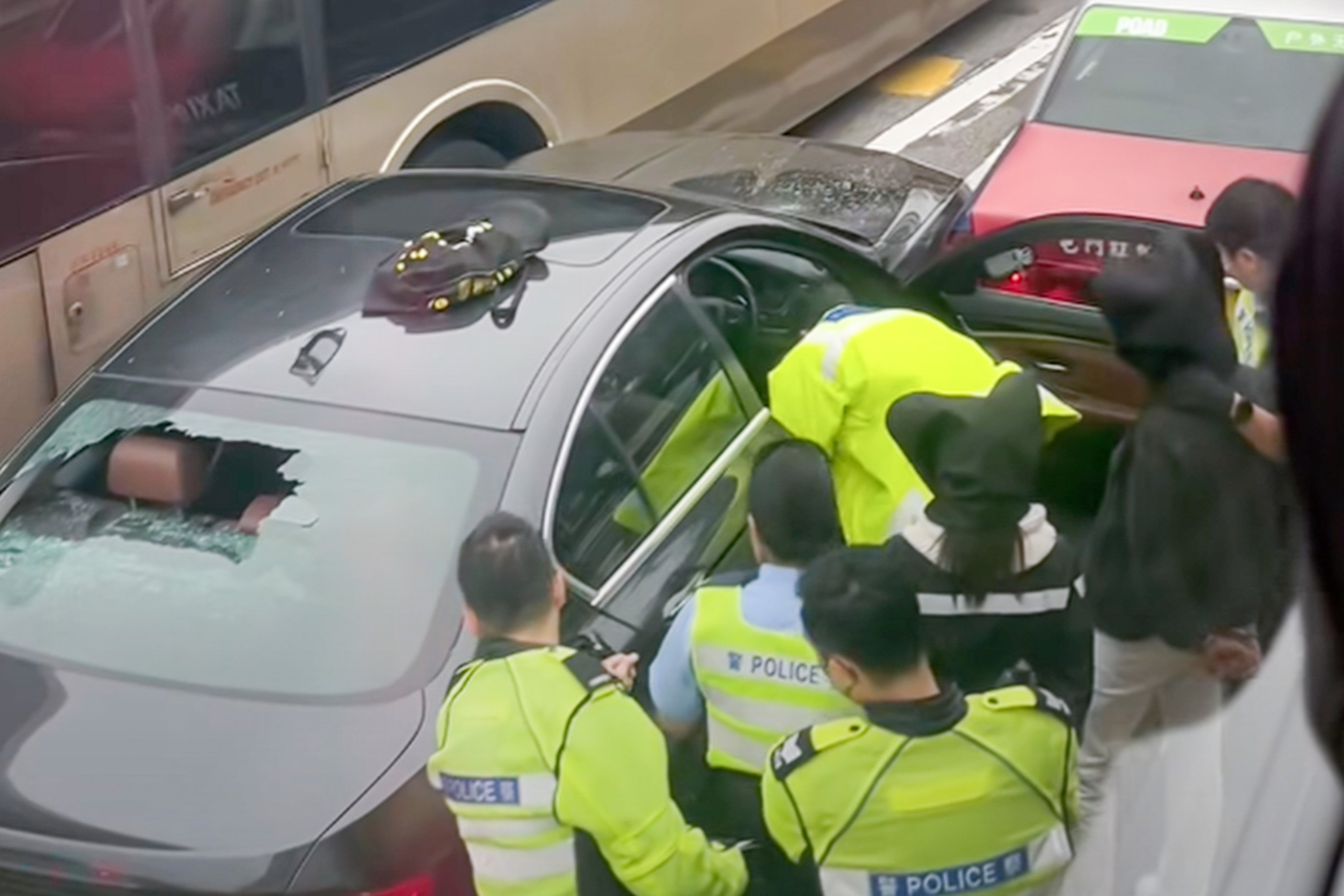 Police arrested two people in the BMW after it hit a taxi and two other vehicles. Photo: Handout