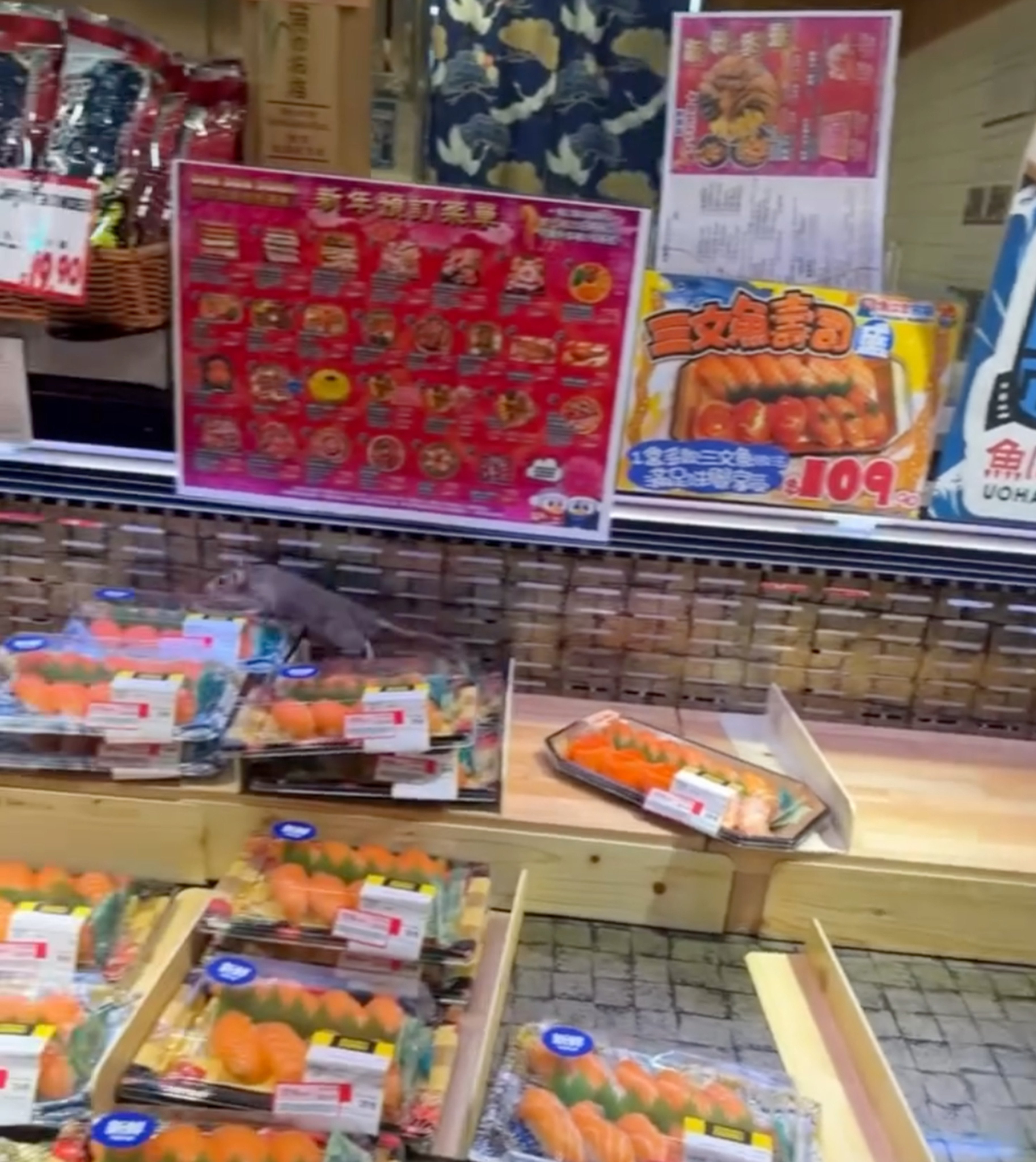 The footage on Threads shows a rat climbing across boxes of sushi in the supermarket display chiller. Photo: Threads