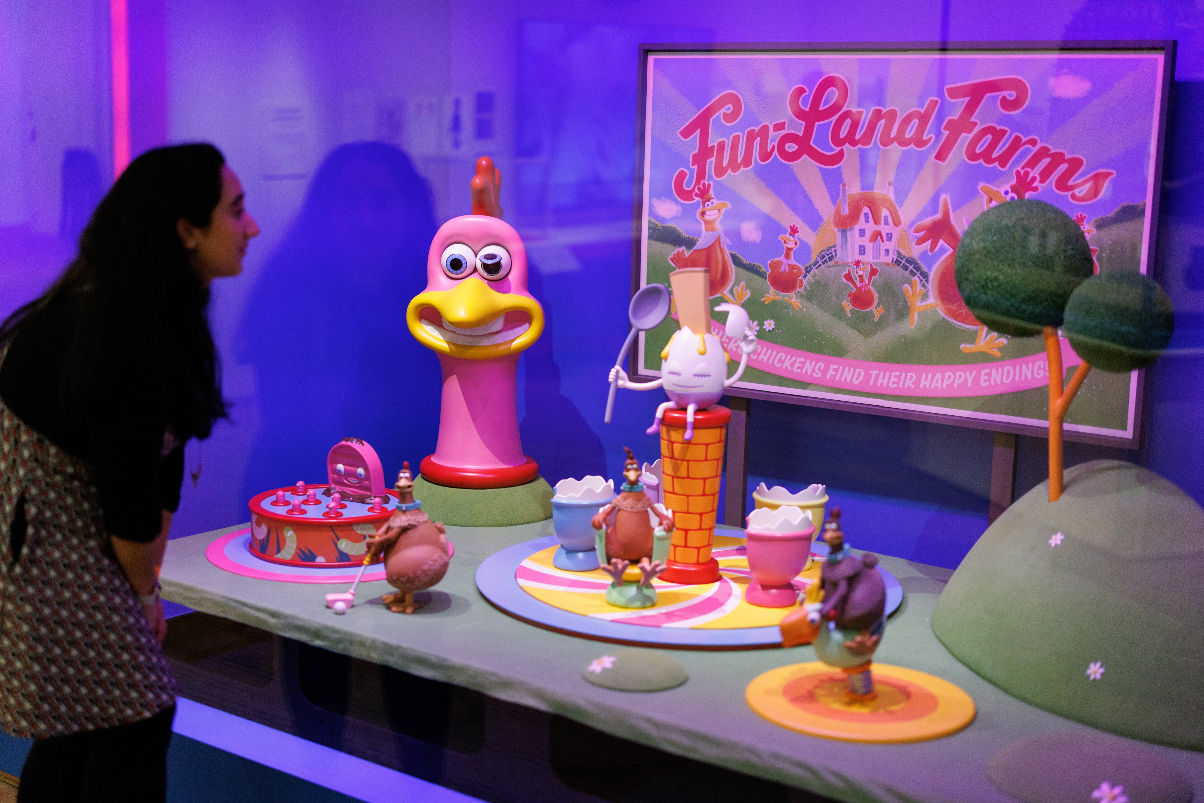 A visitor looks at the Fun-Land Farms model used in filming of Chicken Run: Dawn of the Nugget at the “Inside Aardman: Wallace and Gromit and Friends” exhibition at the Young V&A in London, Britain. Photo: EPA