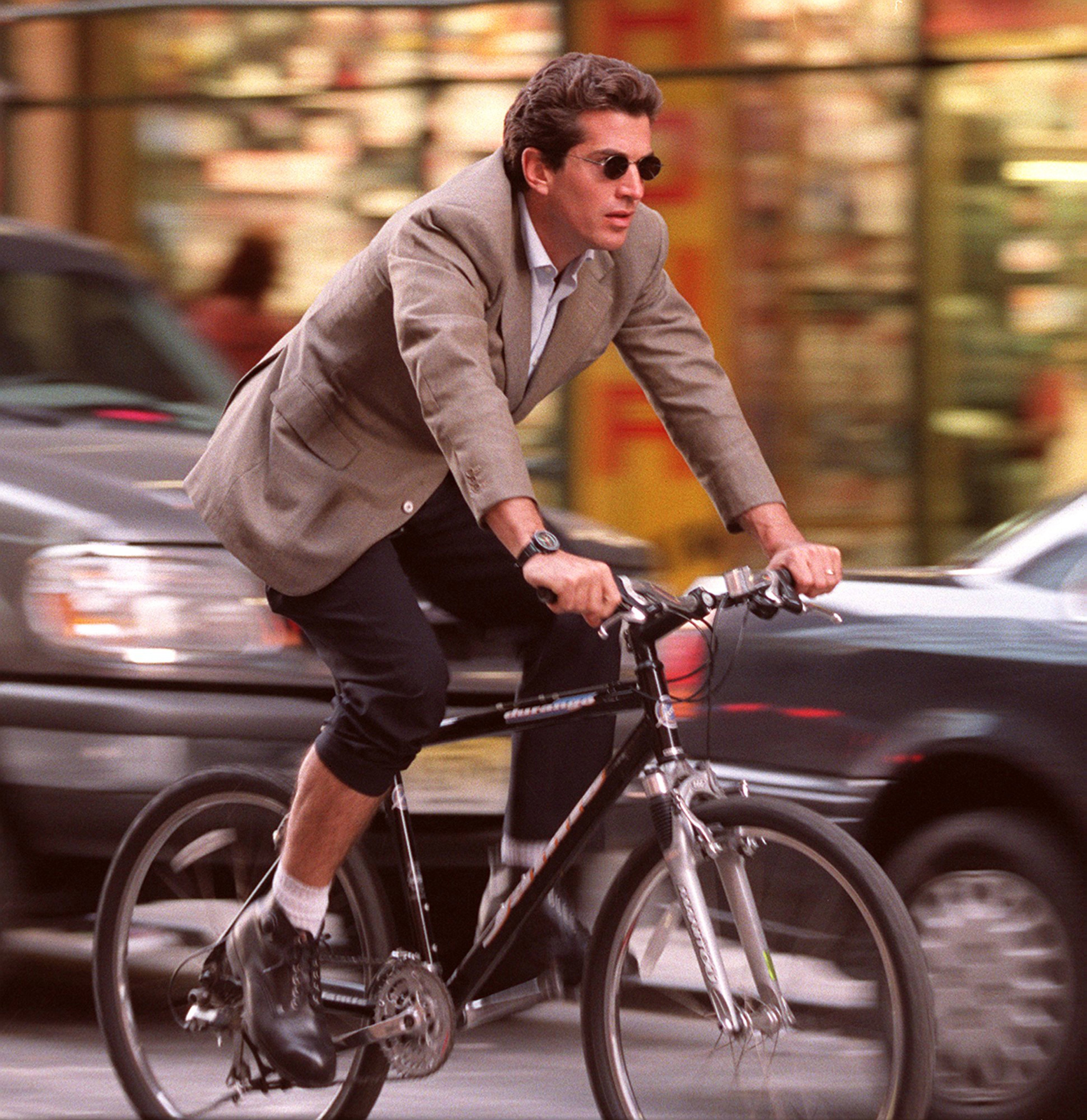 John F. Kennedy Jr always looked good – even when negotiating Manhattan’s rush hour traffic on a bike. Photo: Sygma via Getty Images
