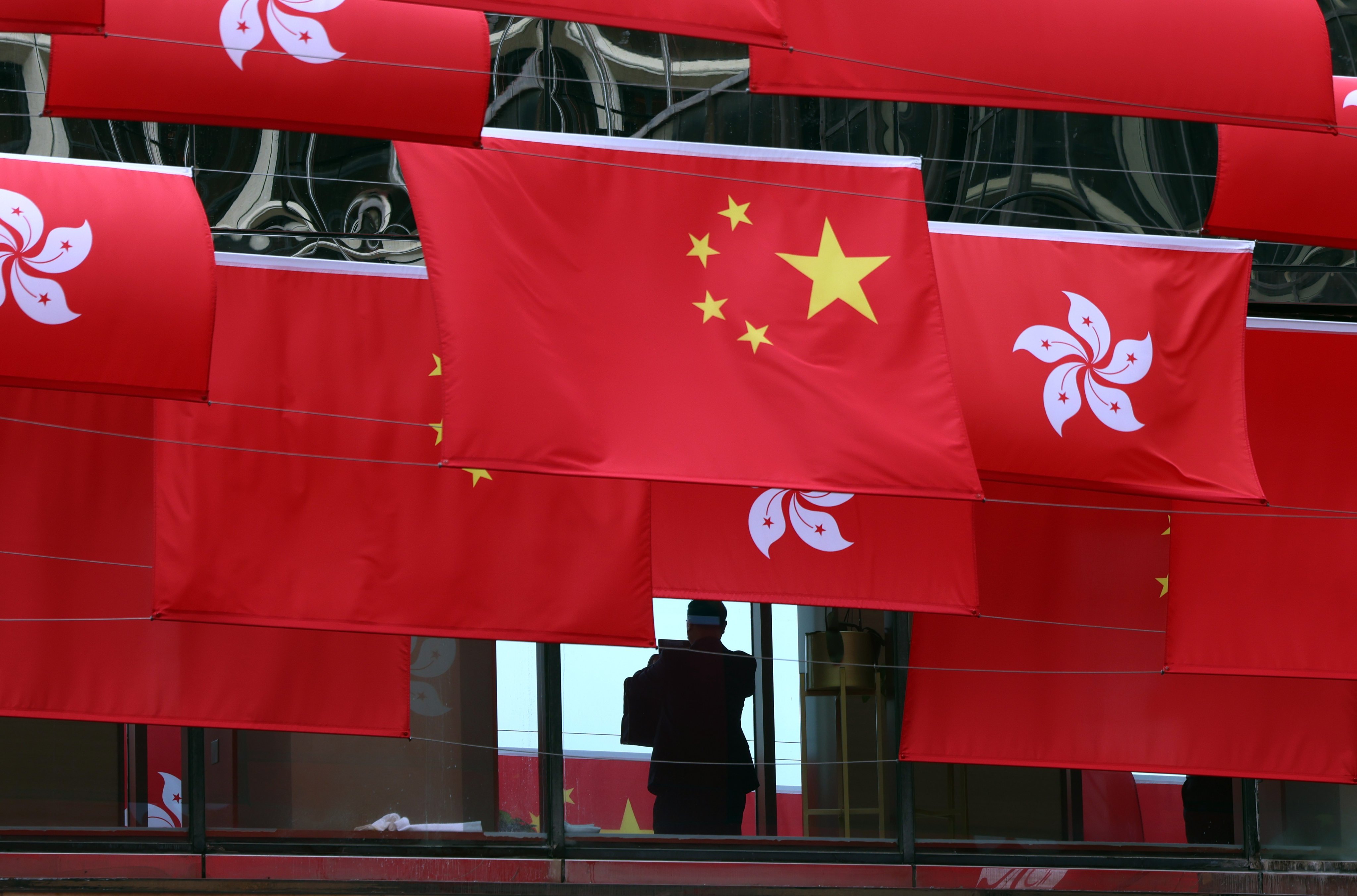 Hong Kong and national flags. A white paper issued by Beijing earlier this week focused on Hong Kong’s obligation in protecting national security under the “one country, two systems” framework. Photo: Jelly Tse
