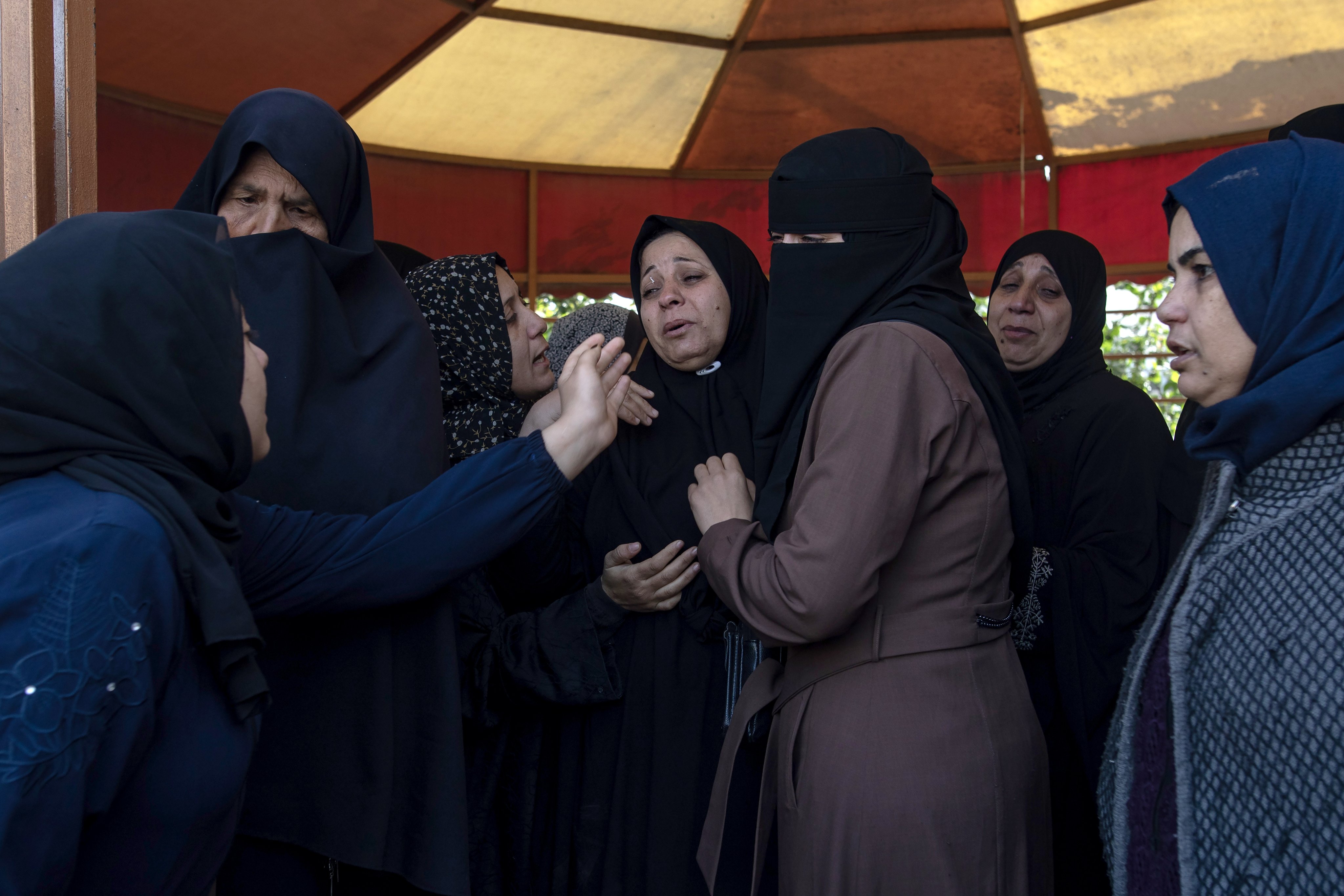 Palestinians mourn during funerals in the southern Gaza Strip on Sunday. Photo: EPA