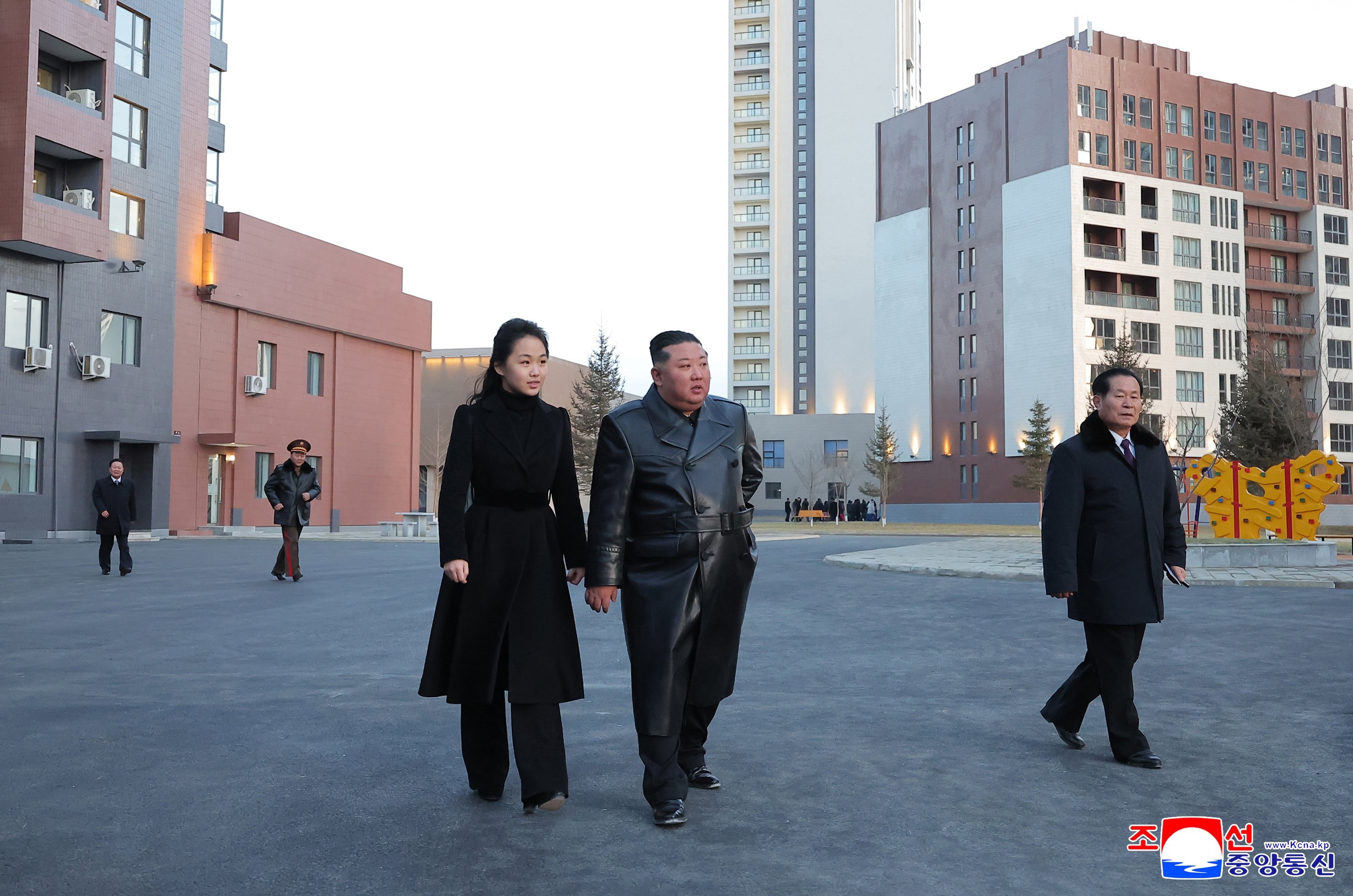 North Korean leader Kim Jong-un (centre, right) and his daughter, Kim Ju-ae, touring Saeppyol Street, a new housing district in Pyongyang dedicated to the families of fallen soldiers, on Sunday. Photo; EPA/KCNA