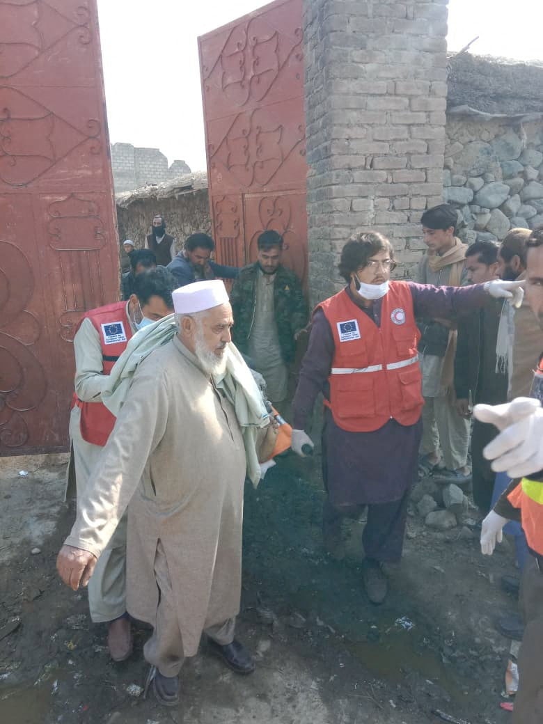 Emergency workers help the injured after a militant attack in Bajaur, Pakistan, on Tuesday. Photo: Pakistan Red Crescent/Reuters