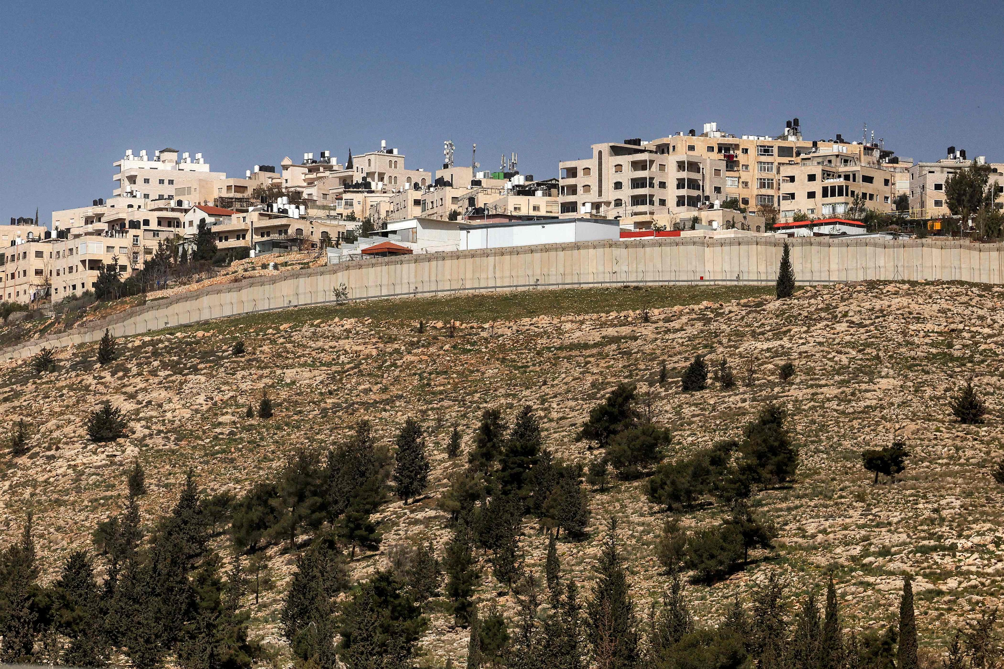 The West Bank village of al-Ram is seen behind Israel’s separation barrier from the outskirts of Jerusalem on Monday. Photo: AFP