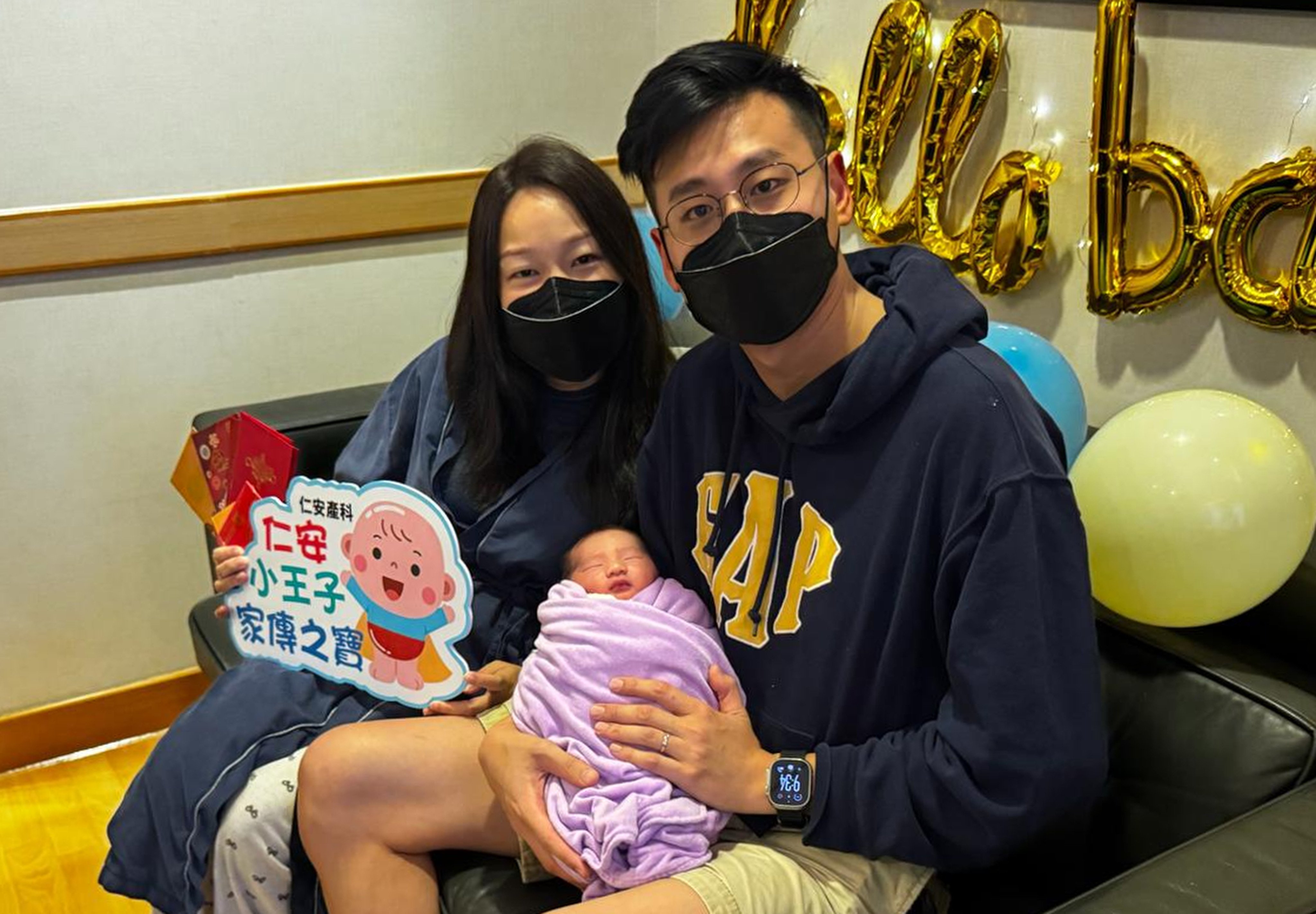 Mr and Mrs Tang with their baby boy at Union Hospital. Photo: handout
