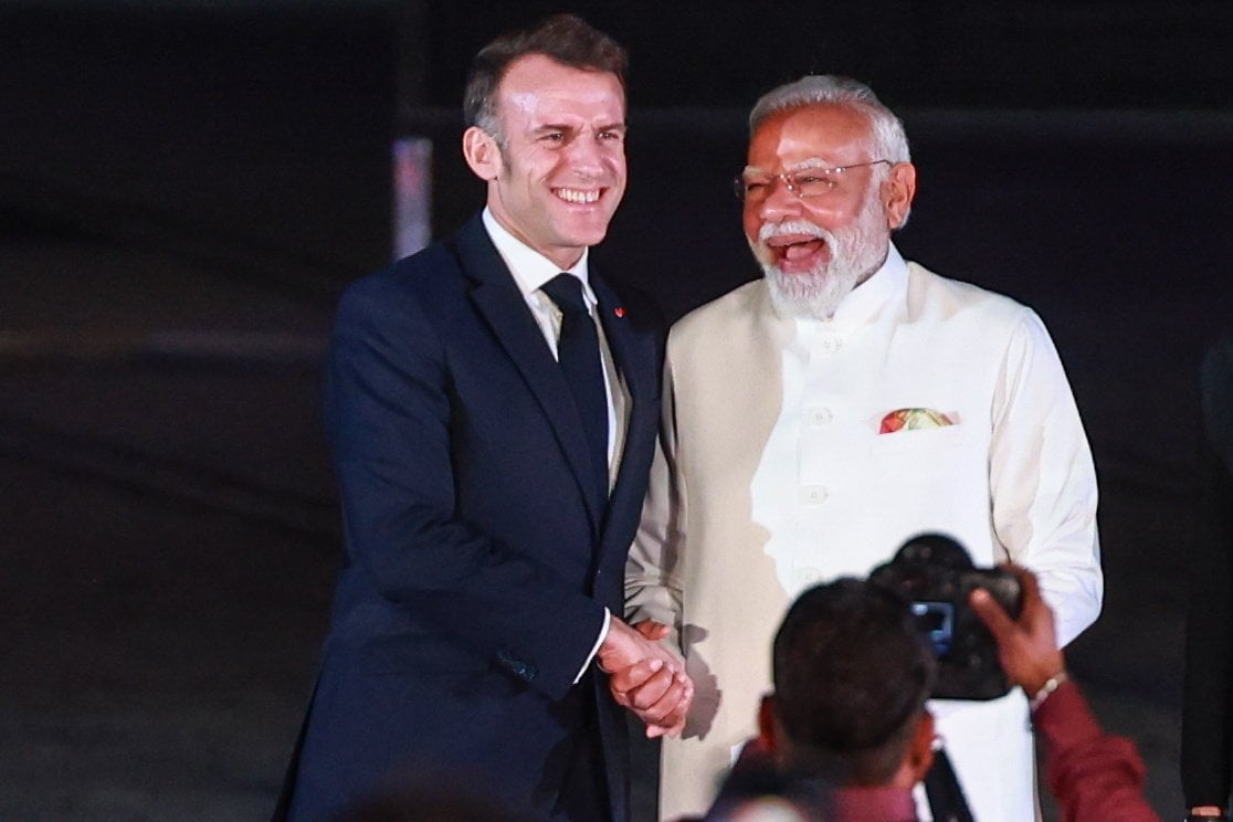 French President Emmanuel Macron and Indian Prime Minister Narendra Modi shake hands as they arrive for the India-France Year of Innovation and Cultural Commemoration event in Mumbai on Tuesday. Photo: EPA