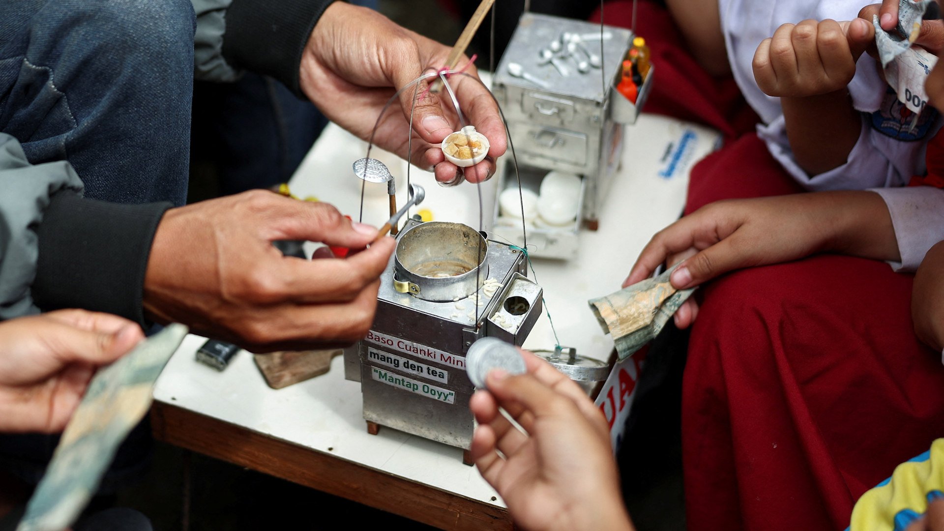 The miniature artist became a street vendor after his tiny culinary creations caught the eye of children and adults alike.