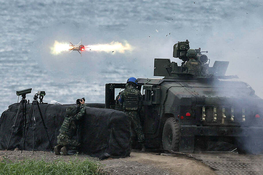 Taiwanese soldiers launch a US-made tube-launched, optically tracked, wire-guided (TOW)-2A missile from a M1167 TOW carrier vehicle at the Fangshan training grounds in Pingtung on August 26, 2024. Photo: Reuters