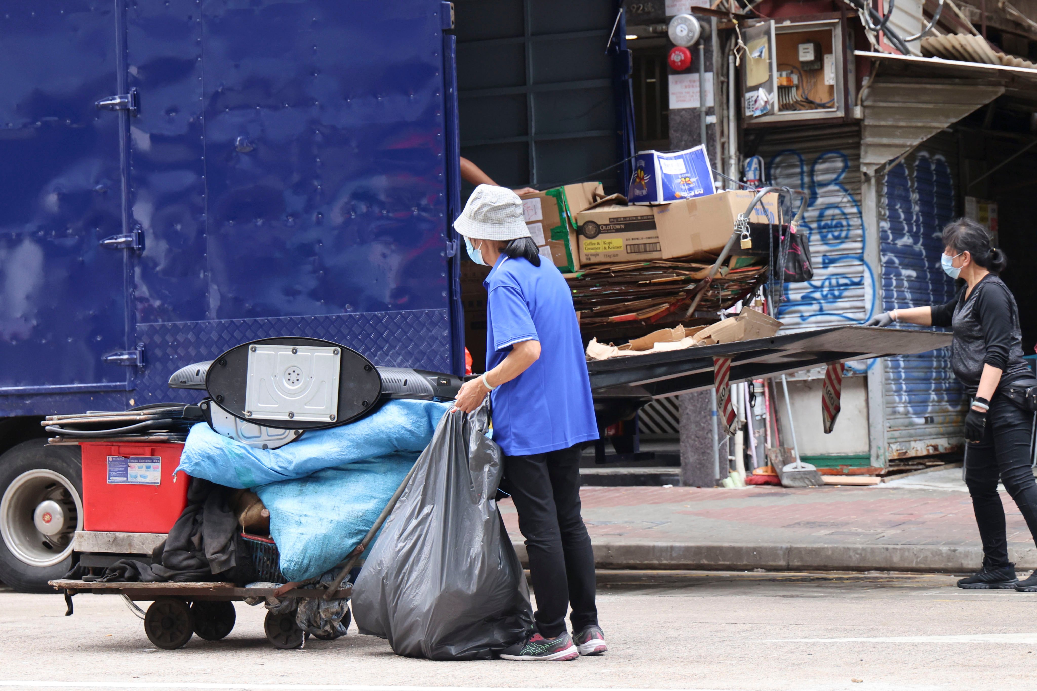 Cleaning workers on the job in Mong Kok on May 1, 2025. Photo: Jelly Tse