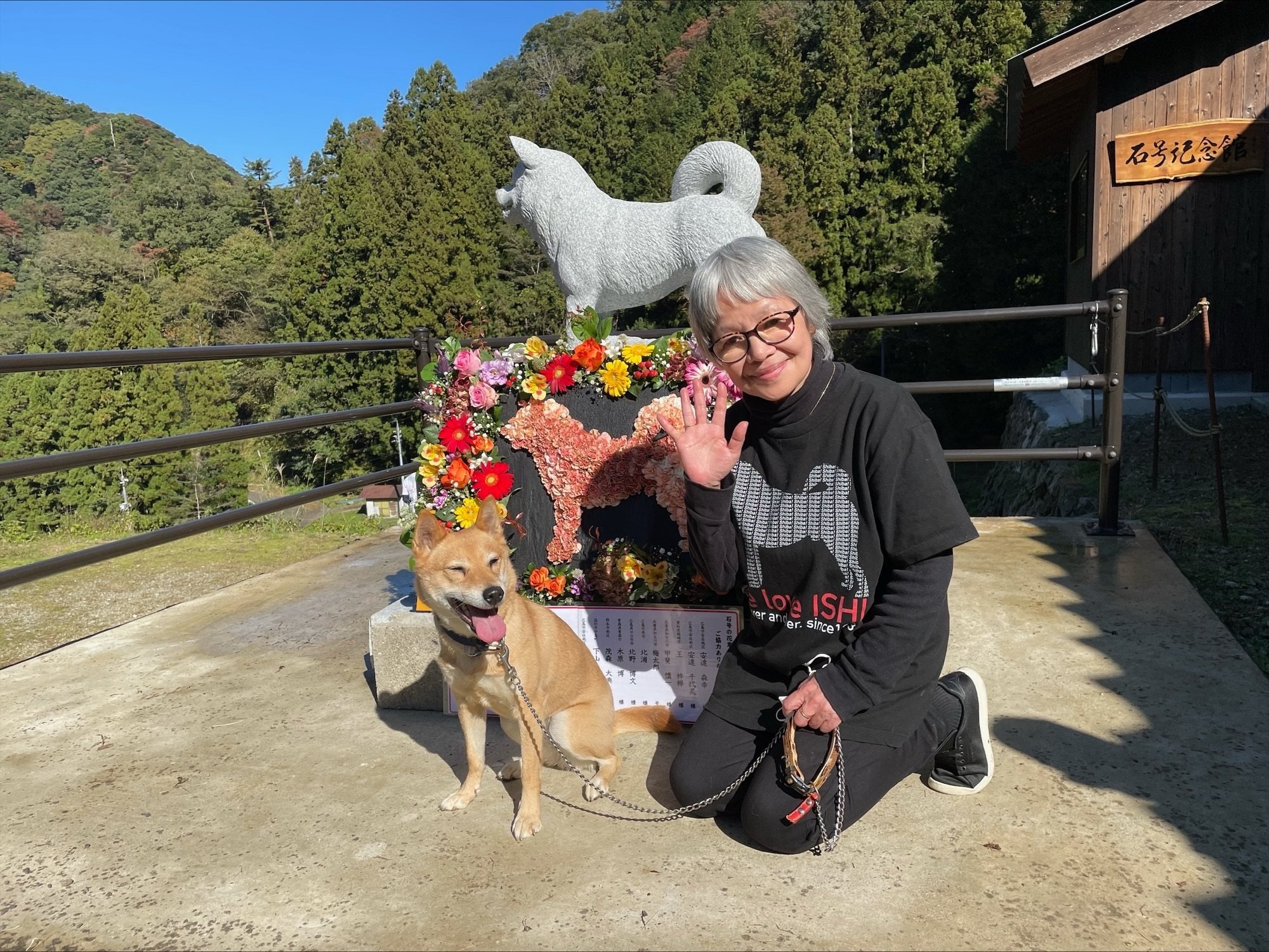 Mayumi Kawabe smiles in front of the stone statue of Ishi Go, an early ancestor of today’s Shiba Inu breed, in Masuda, Shimane, Japan. At the end of 2016, she welcomed Sunny, a two-month-old puppy, into her home. Photo: Kyodo