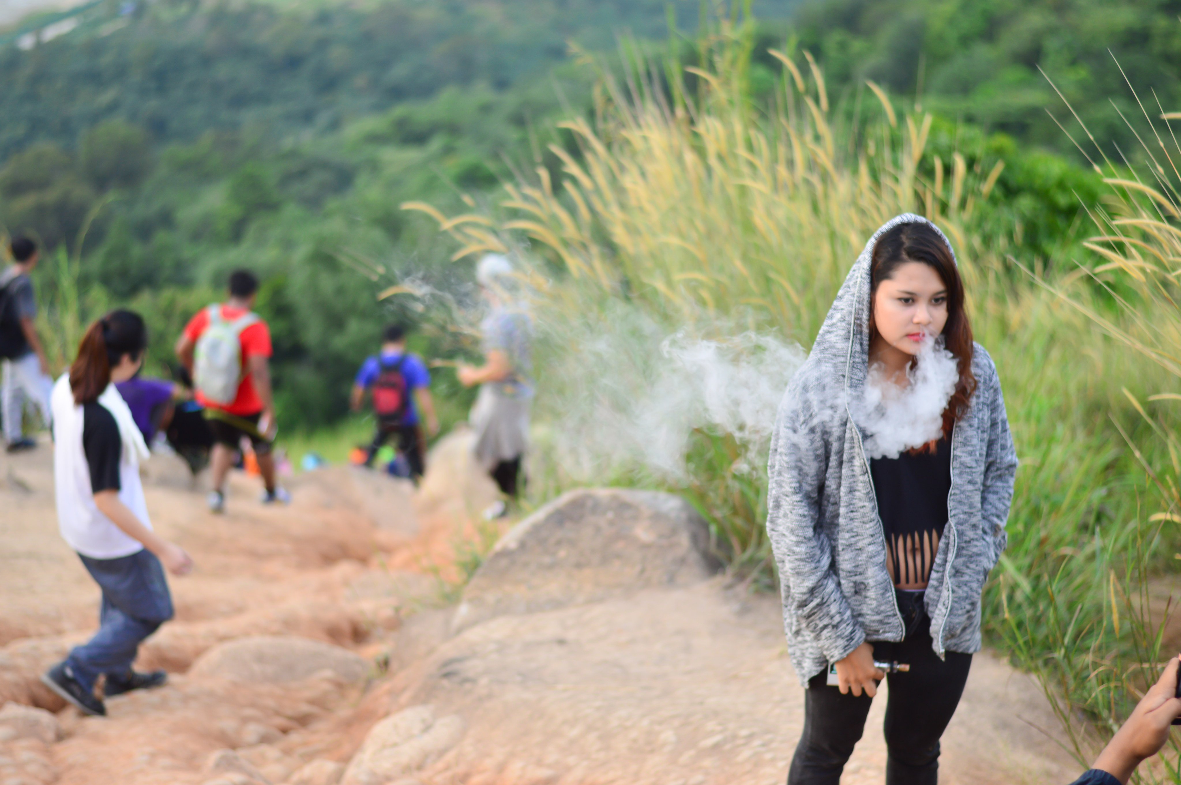 A person vapes during a hike in Negeri Sembilan state, Malaysia. Photo: Shutterstock