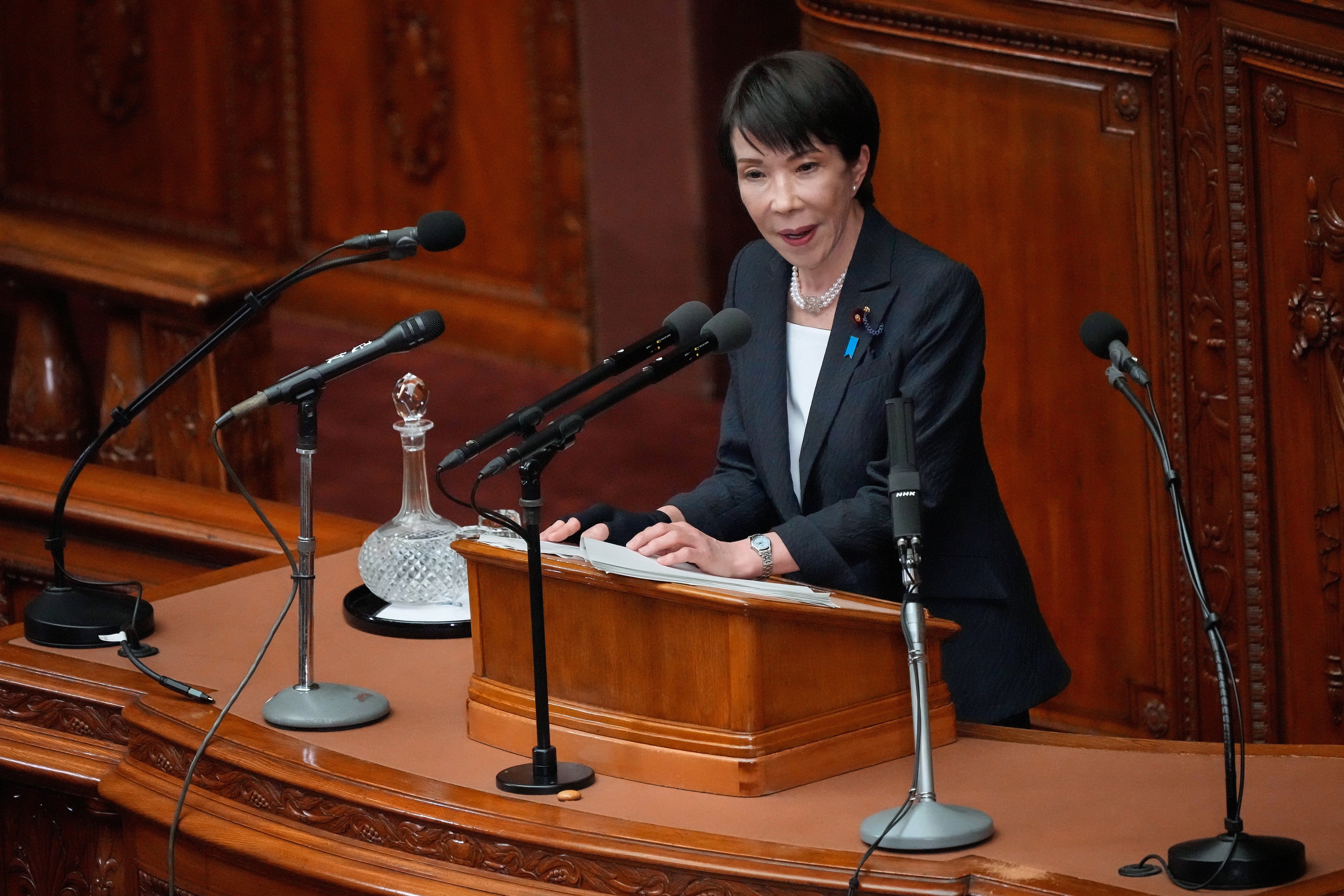 Japanese Prime Minister Sanae Takaichi addresses parliament in Tokyo on Friday. Photo: AP