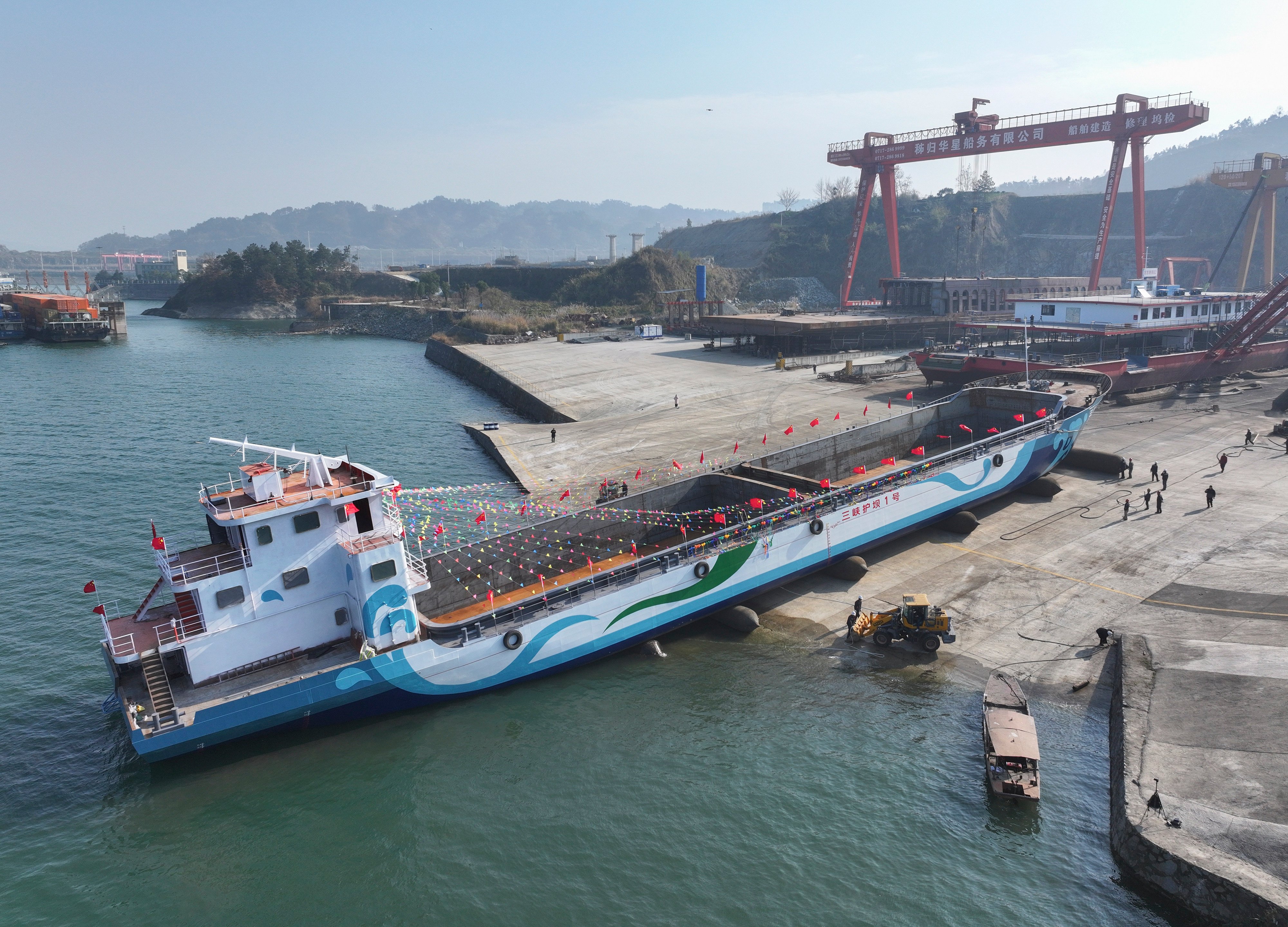 China is building electric cargo ships to decarbonise the nation’s waterways. This December 2024 image shows the nation’s first “clean drift transfer” ship, which is a zero-emission vessel designed to collect floating debris and waste from rivers, lakes or coastal areas. Photo: Getty Images