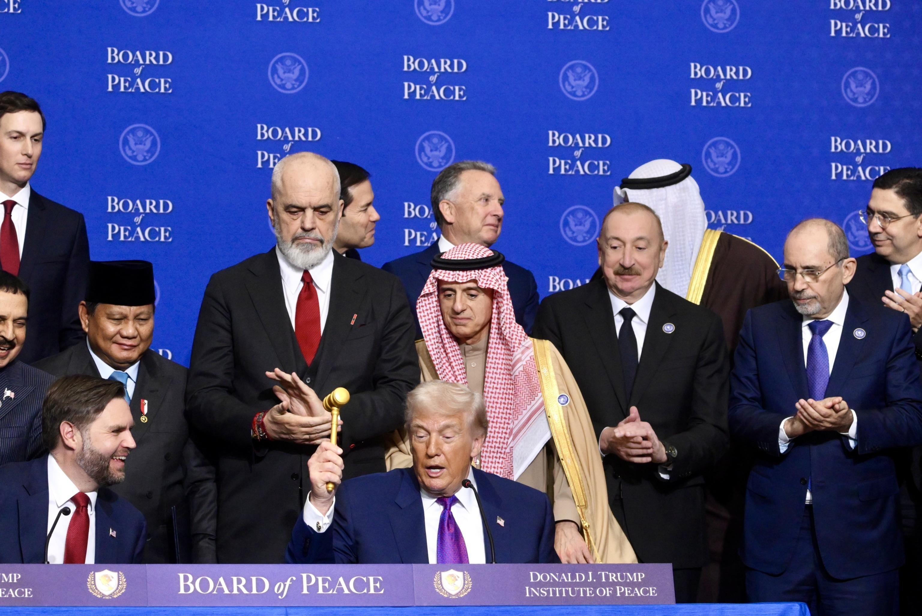 US President Donald Trump raises the gavel during the “Board of Peace” meeting in Washington on Thursday. Photo: EPA