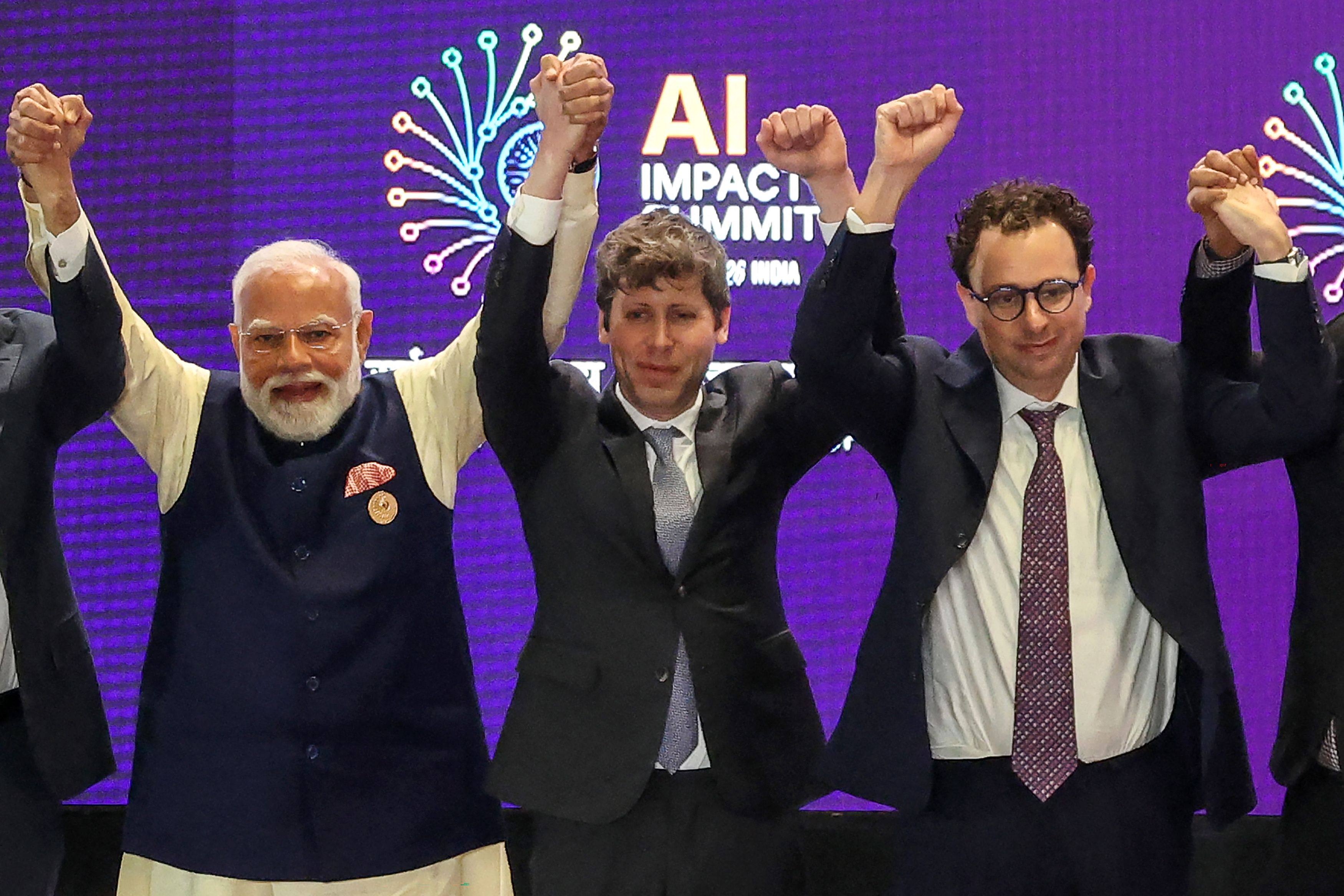 India’s Prime Minister Narendra Modi (left) takes a group photo with OpenAI CEO Sam Altman (centre) and Anthropic’s Dario Amodei (right) at the AI Impact Summit in New Delhi on Thursday. Photo: AFP