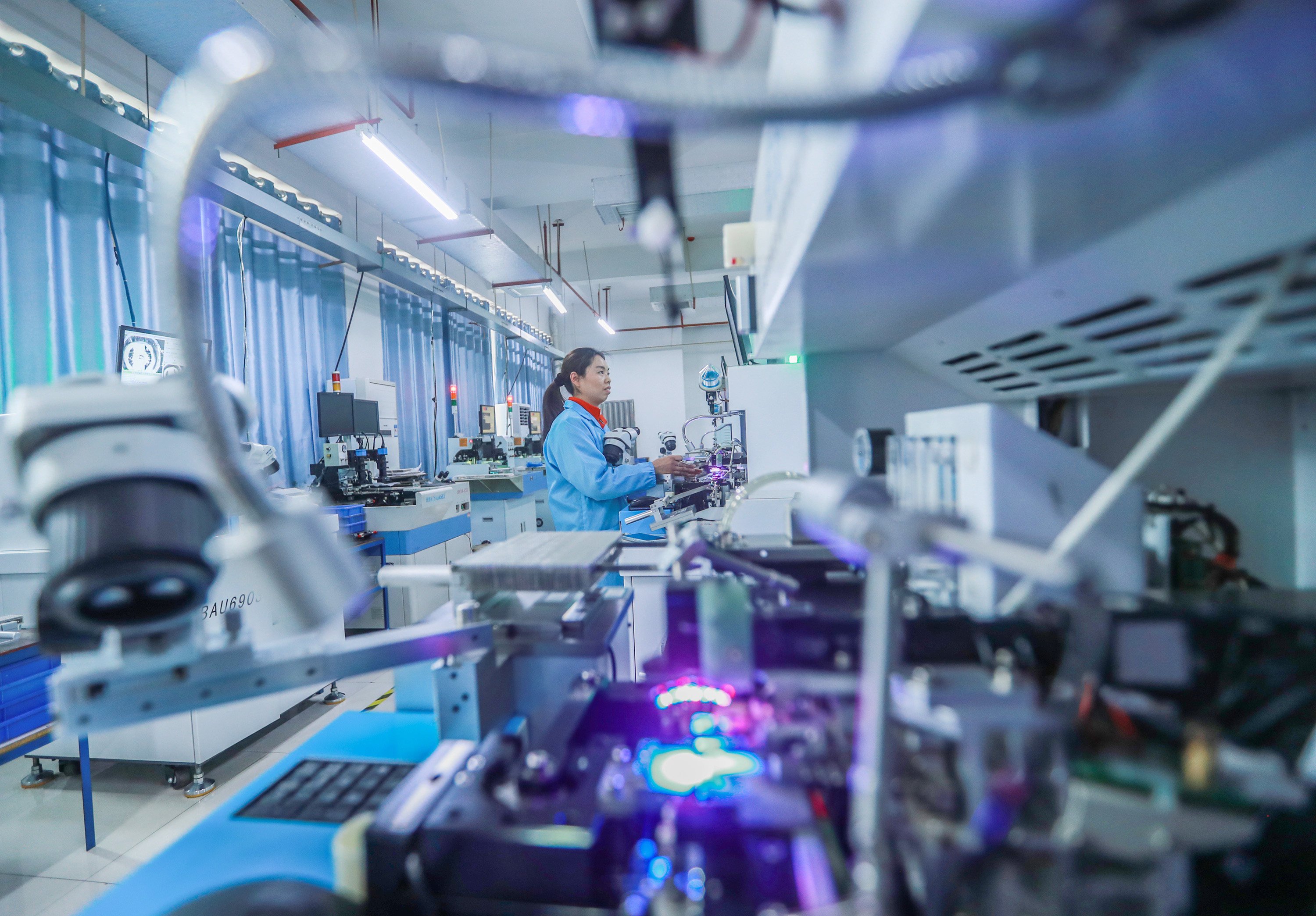 A worker is seen on an LED production line at an electronics company in Zigui county, central China’s Hubei province, on January 27. Photo: Xinhua