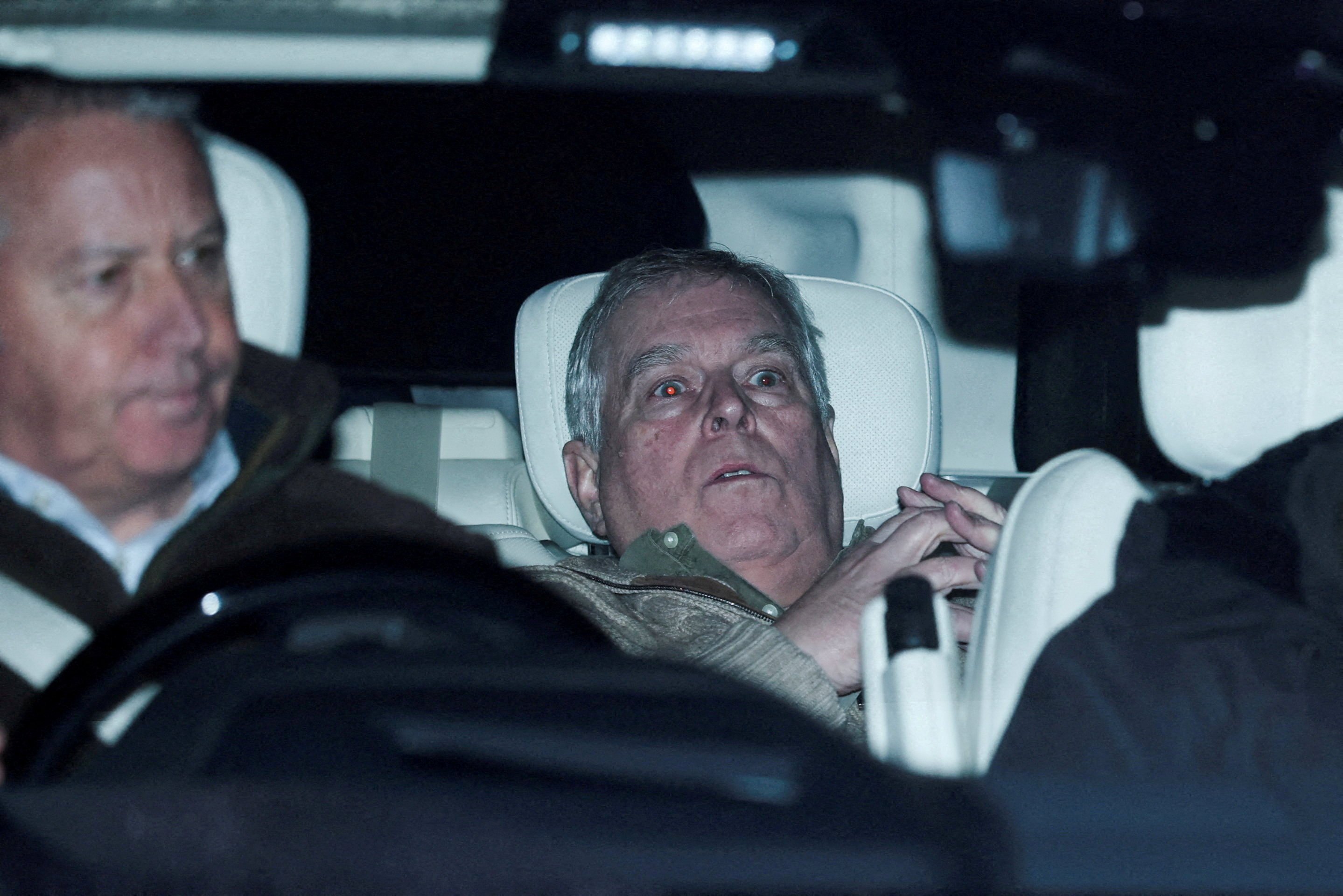 Andrew Mountbatten Windsor, leaves Aylsham Police Station in a vehicle on Thursday. Photo: Reuters