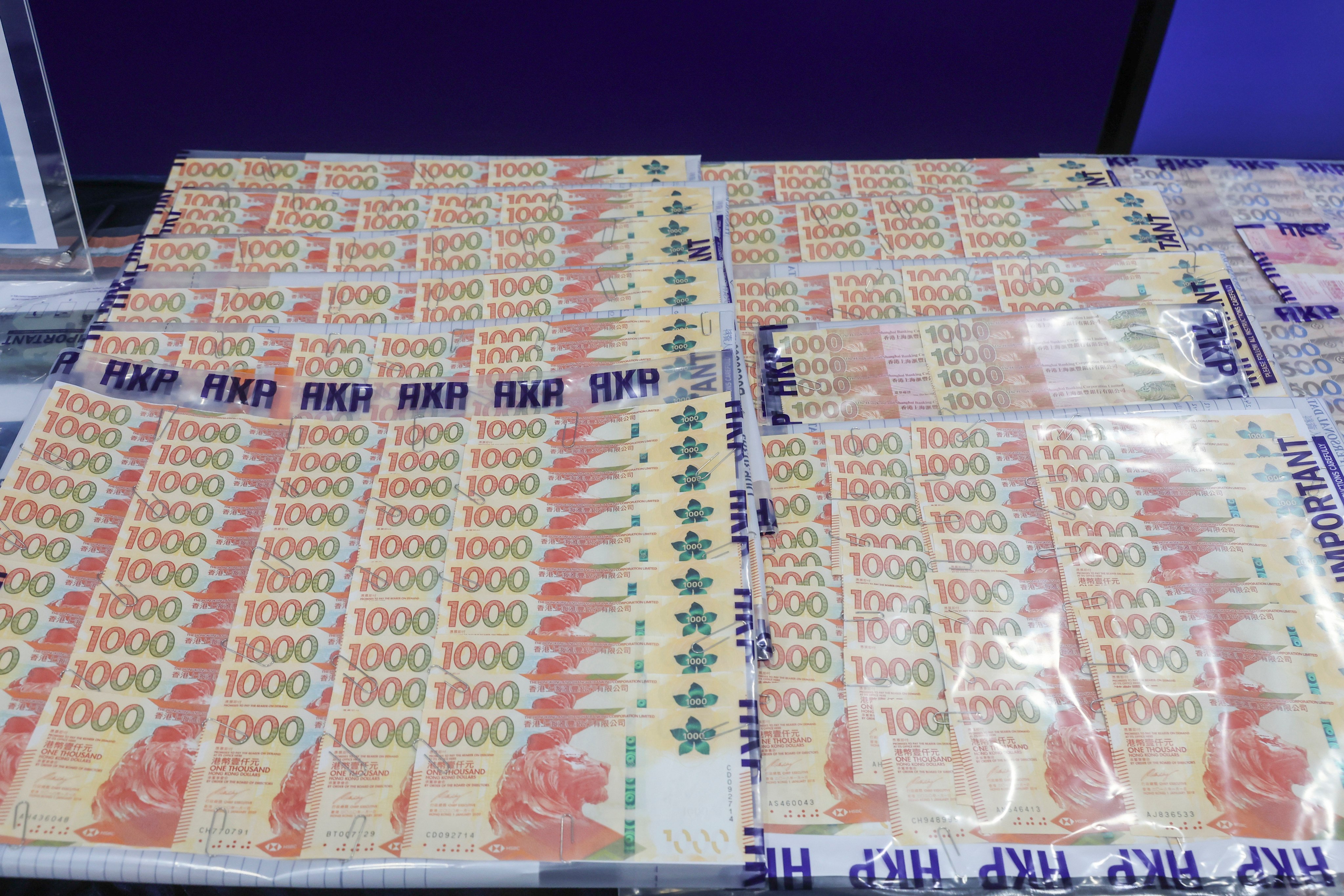 Money seized during an operation combating money laundering is displayed at police headquarters in Wan Chai. Photo: Edmond So