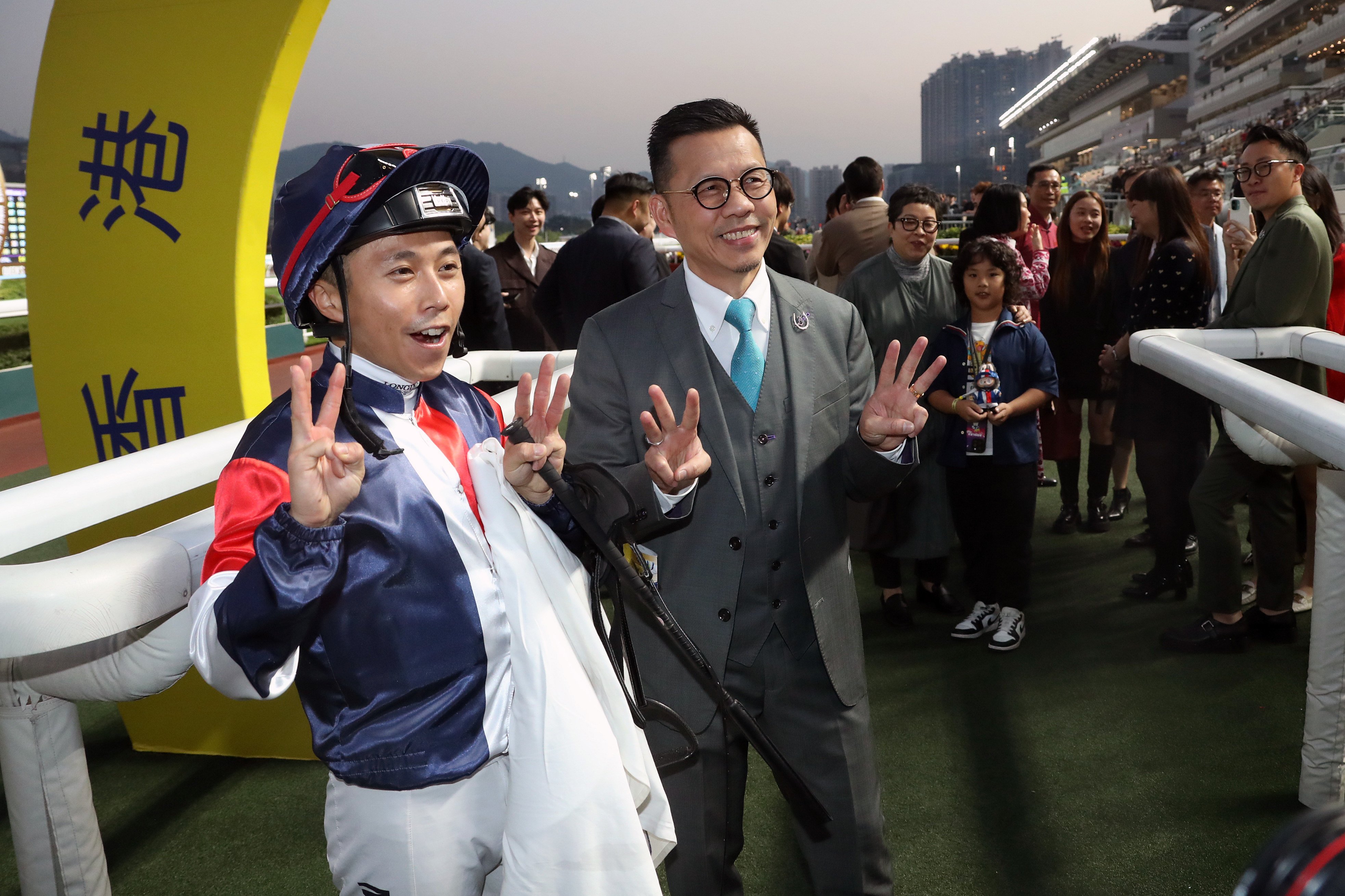 Trainer Frankie Lor and Matthew Poon celebrate their three timers. Photos: Kenneth Chan