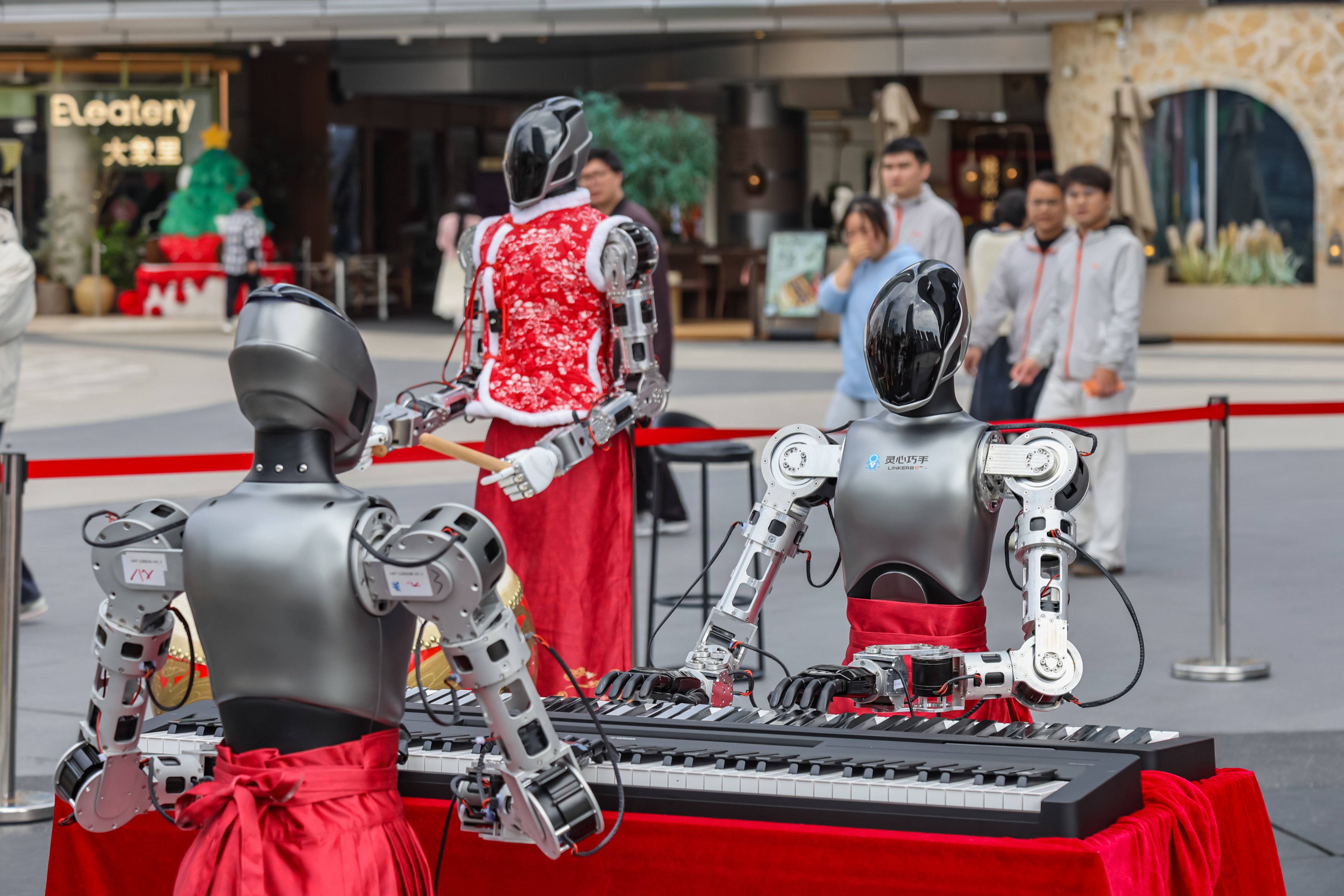 Robots play the piano and drums in Shenzhen. Photo: VCG via Getty Images