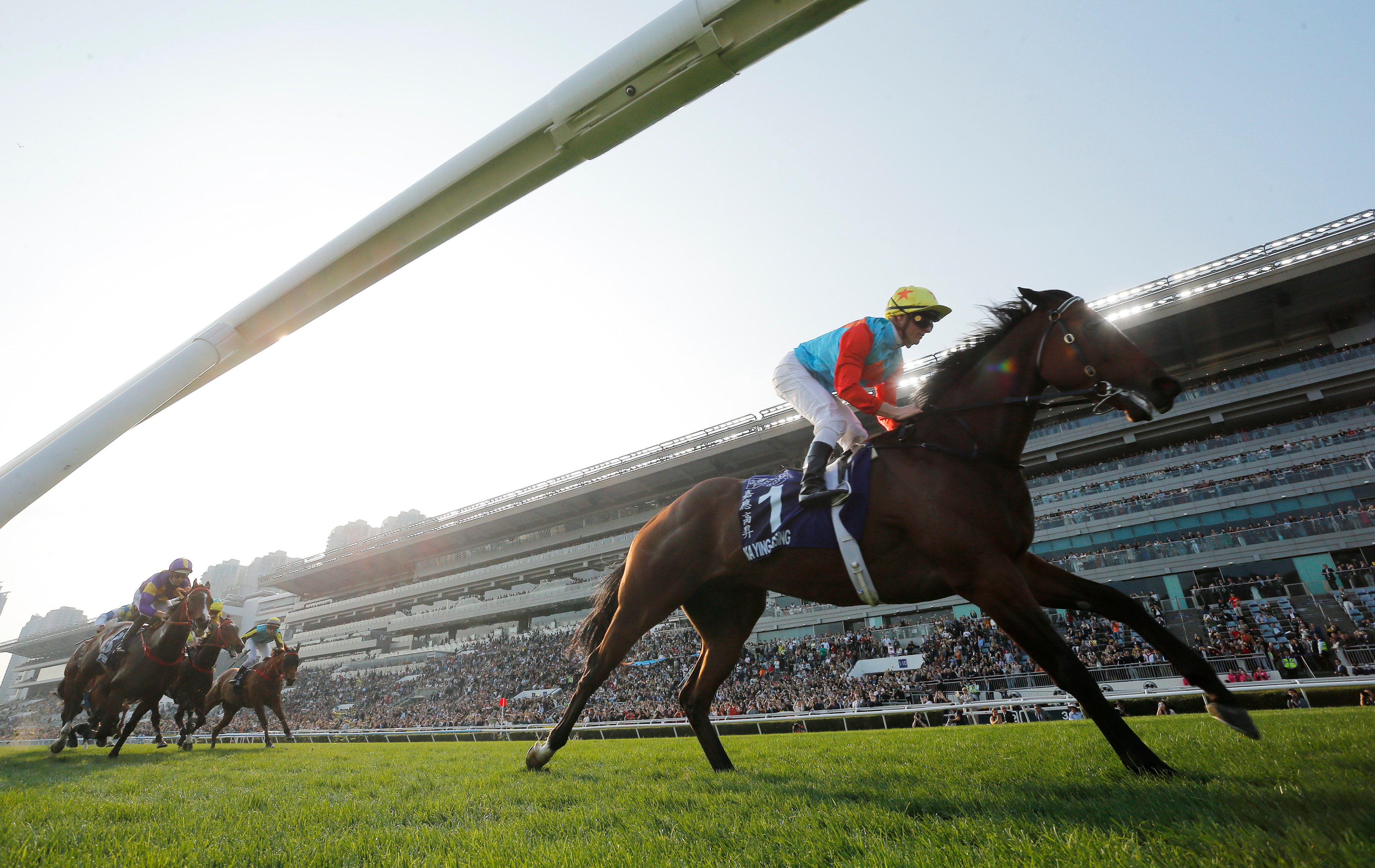 Ka Ying Rising surges clear to win the Queen’s Silver Jubilee Cup. Photos: Kenneth Chan