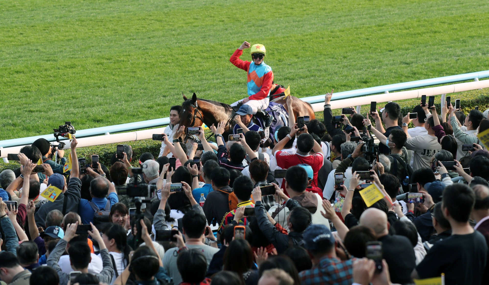 Zac Purton and Ka Ying Rising soak up the attention from Sha Tin fans after their win.