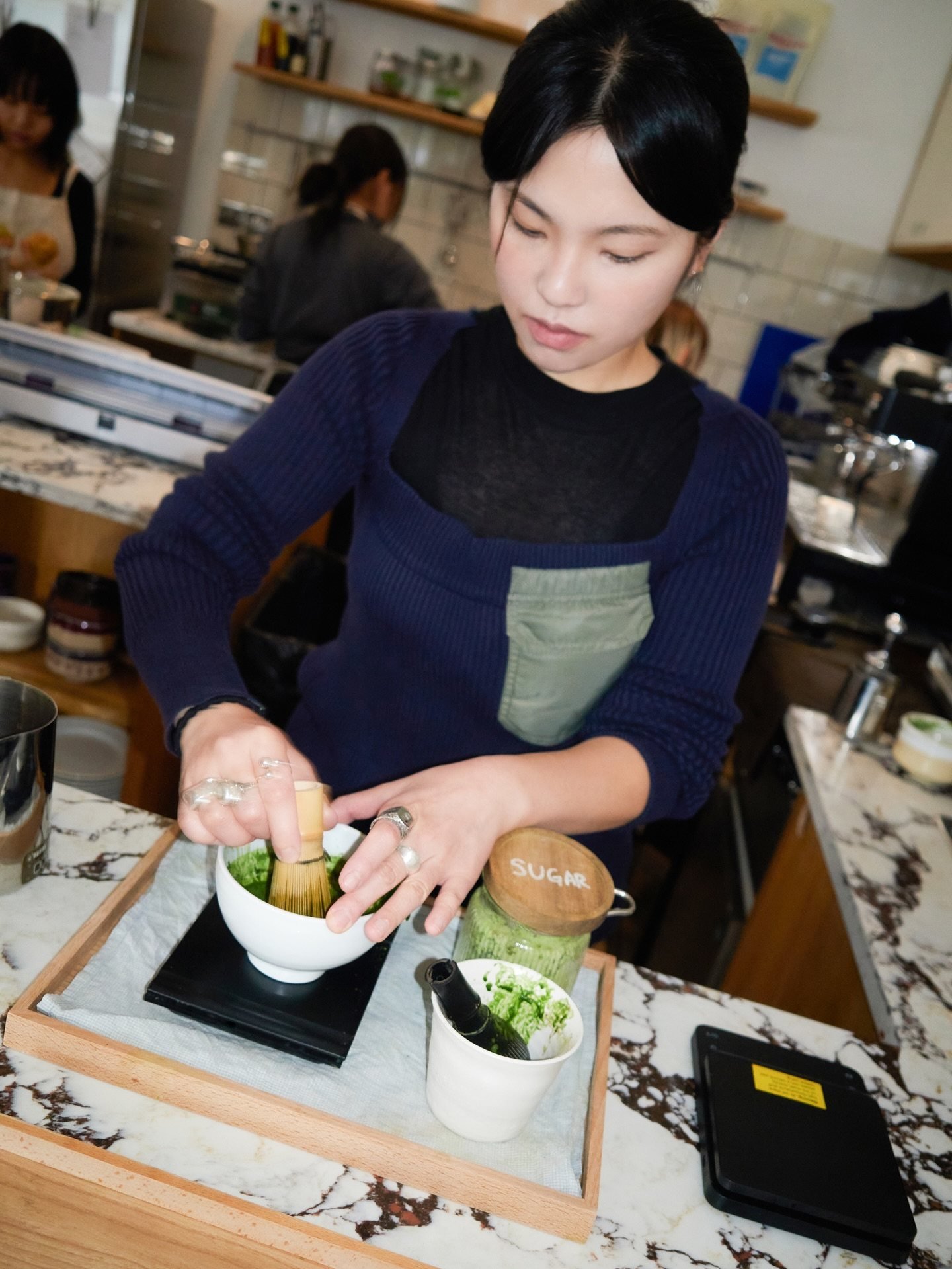 An employee prepares matcha at Look Left by Yugu, a Korean cafe in London that serves matcha and Korean-fusion food. Photo: Instagram/lookleftbyyugu