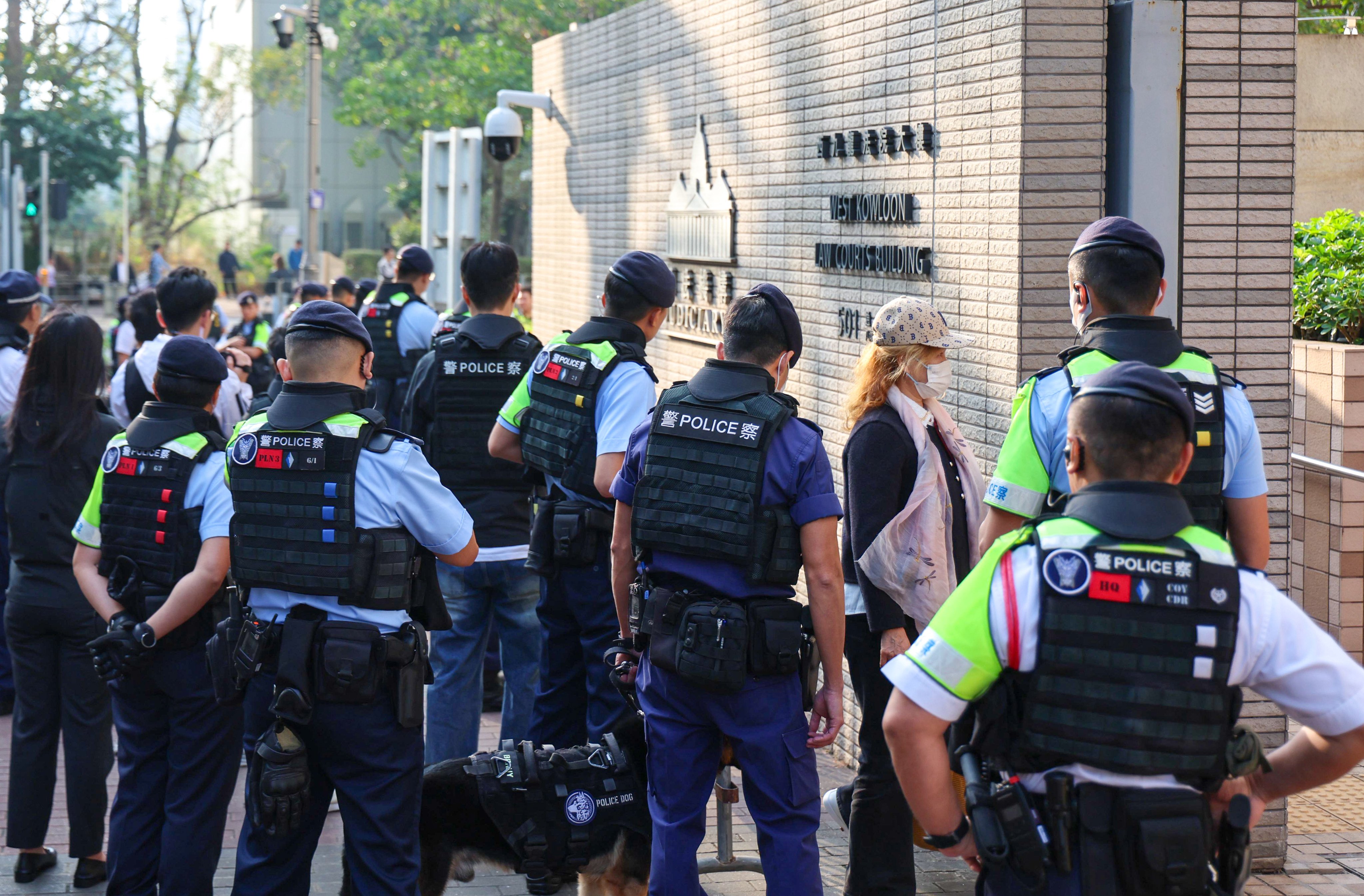 Police officers stand guard outside West Kowloon Court. Photo: Dickson Lee