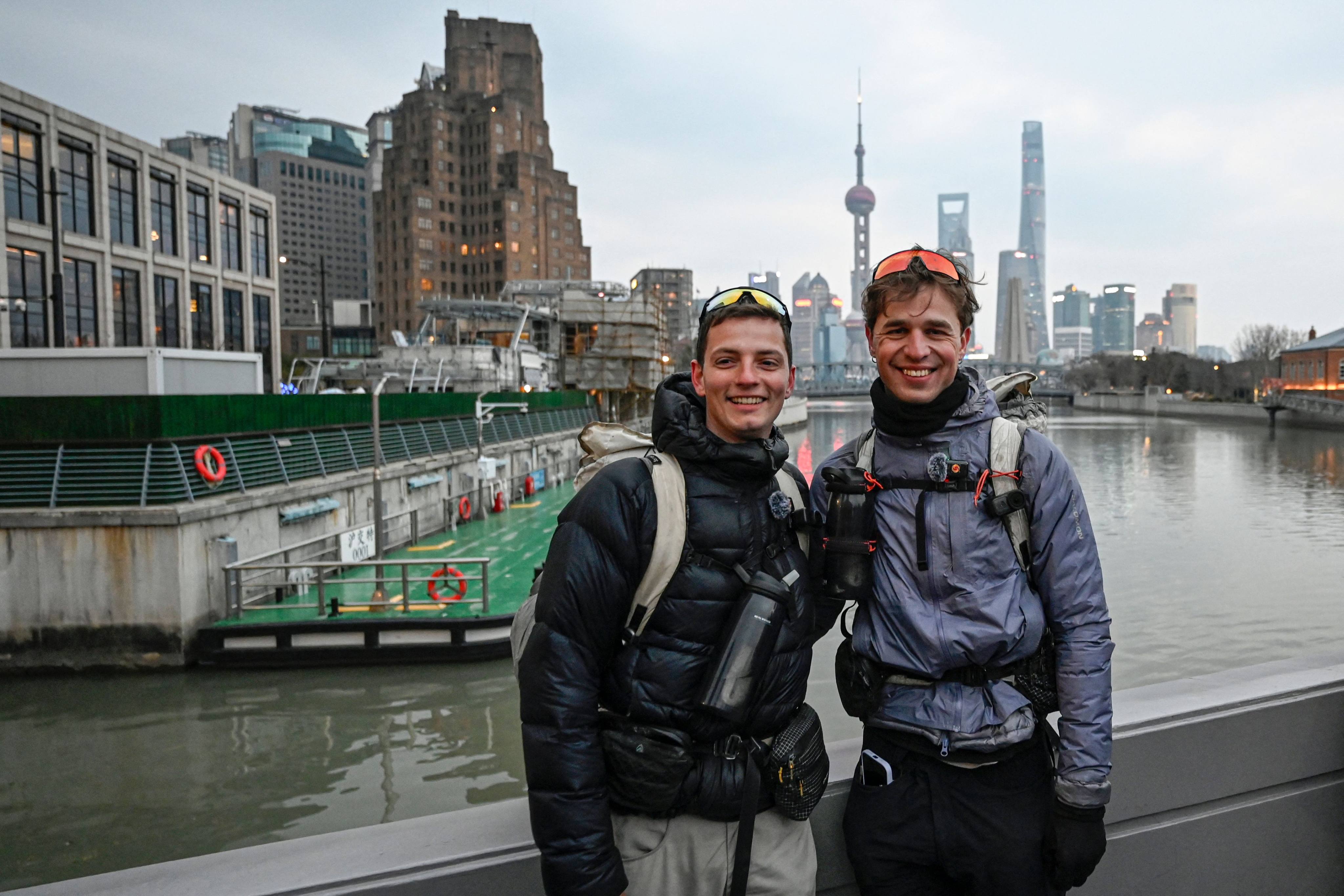 Loic Voisot (right) and Benjamin Humblot pose for photos near the Bund in Shanghai on February 7, 2026. Photo: AFP