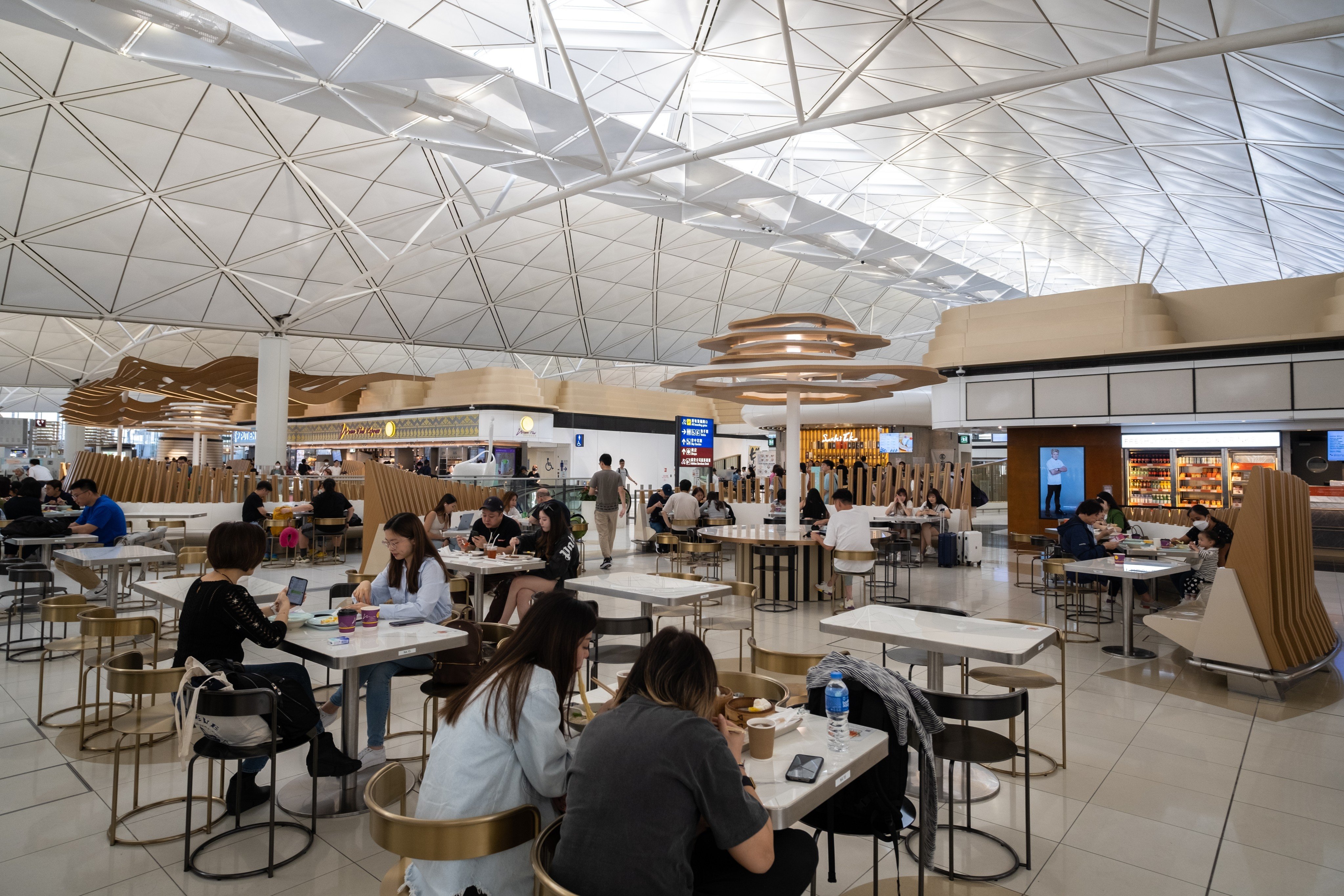 People dine at the food court in the departures area of Hong Kong International Airport. Photo: Shutterstock