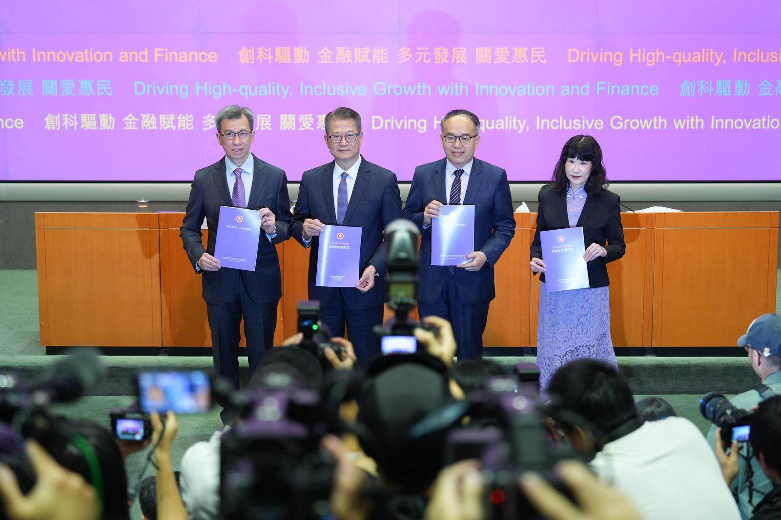 Finance minister Paul Chan (second from left). Photo: Eugene Lee