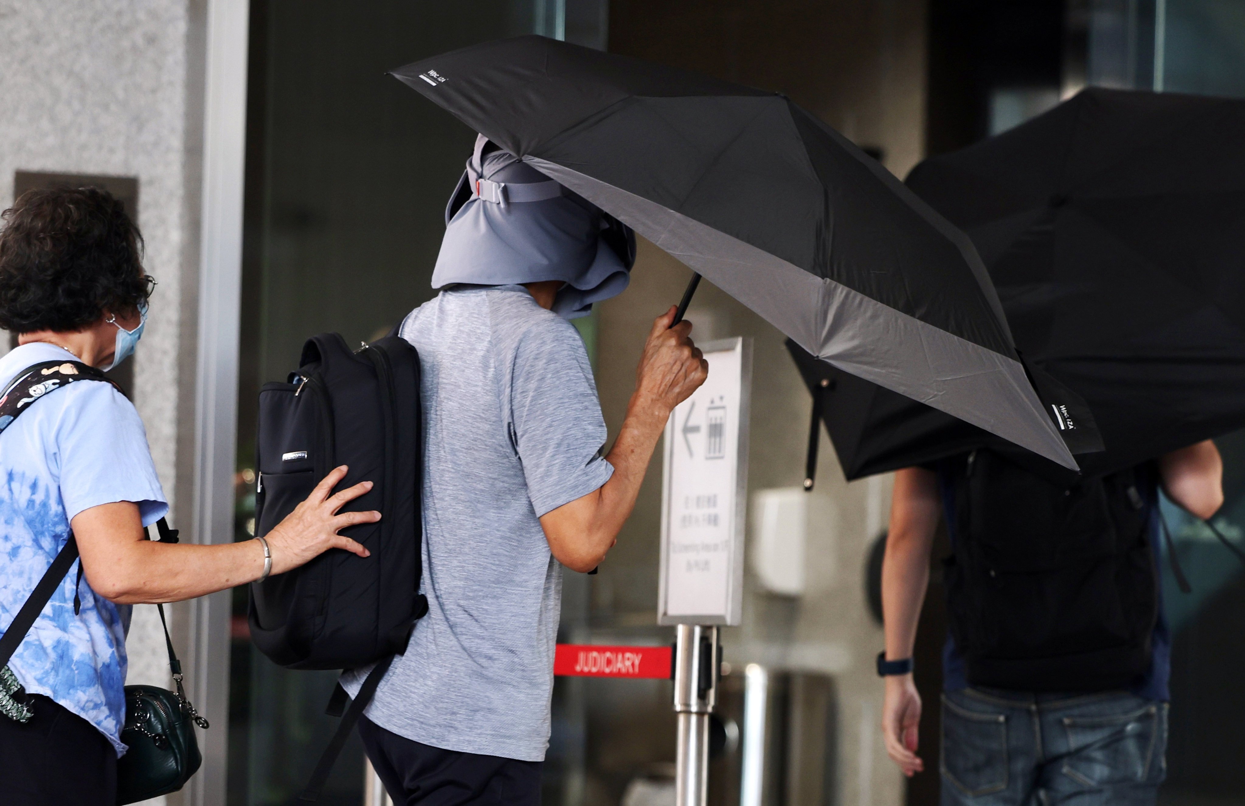 Kwok Yin-sang (centre), the father of US-based activist Anna Kwok, was jailed for eight months. Photo: Edmond So