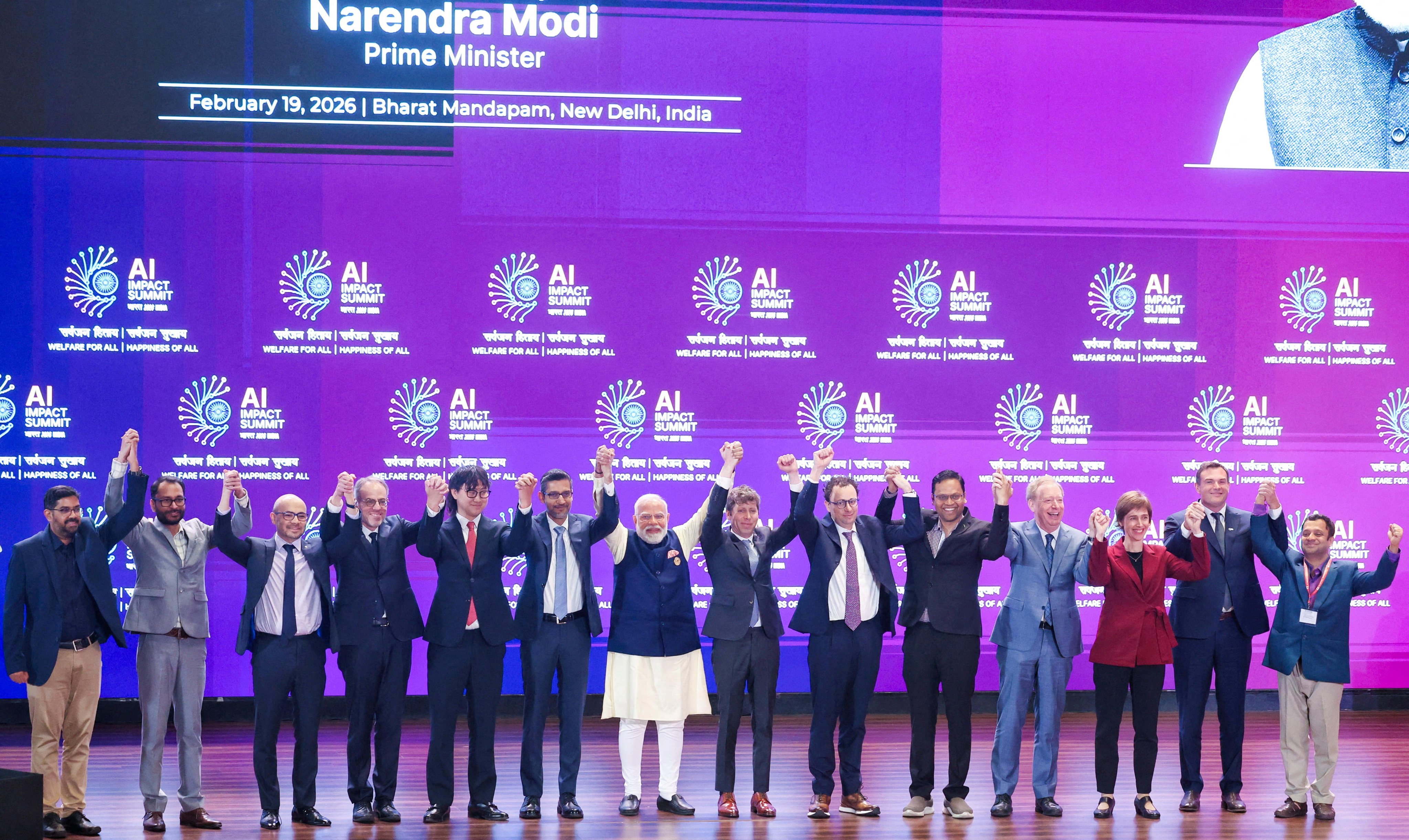 Indian Prime Minister Narendra Modi poses with global tech leaders at the AI Impact Summit in New Delhi on February 19. Photo: India’s Press Information Bureau/Reuters