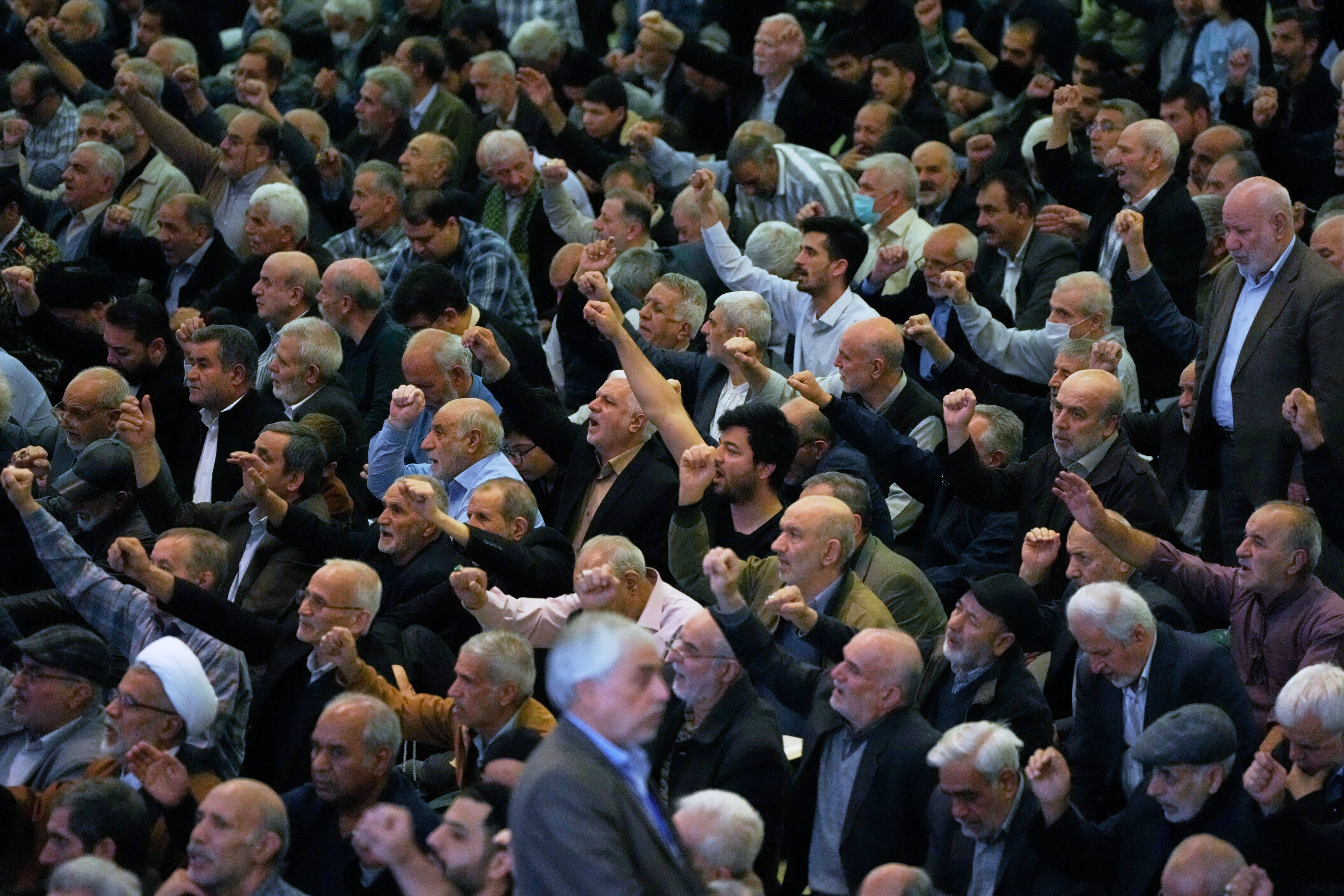 Worshippers chant slogans during the Friday prayers ceremony at the Imam Khomeini Grand Mosque in Tehran, Iran. Photo: AP