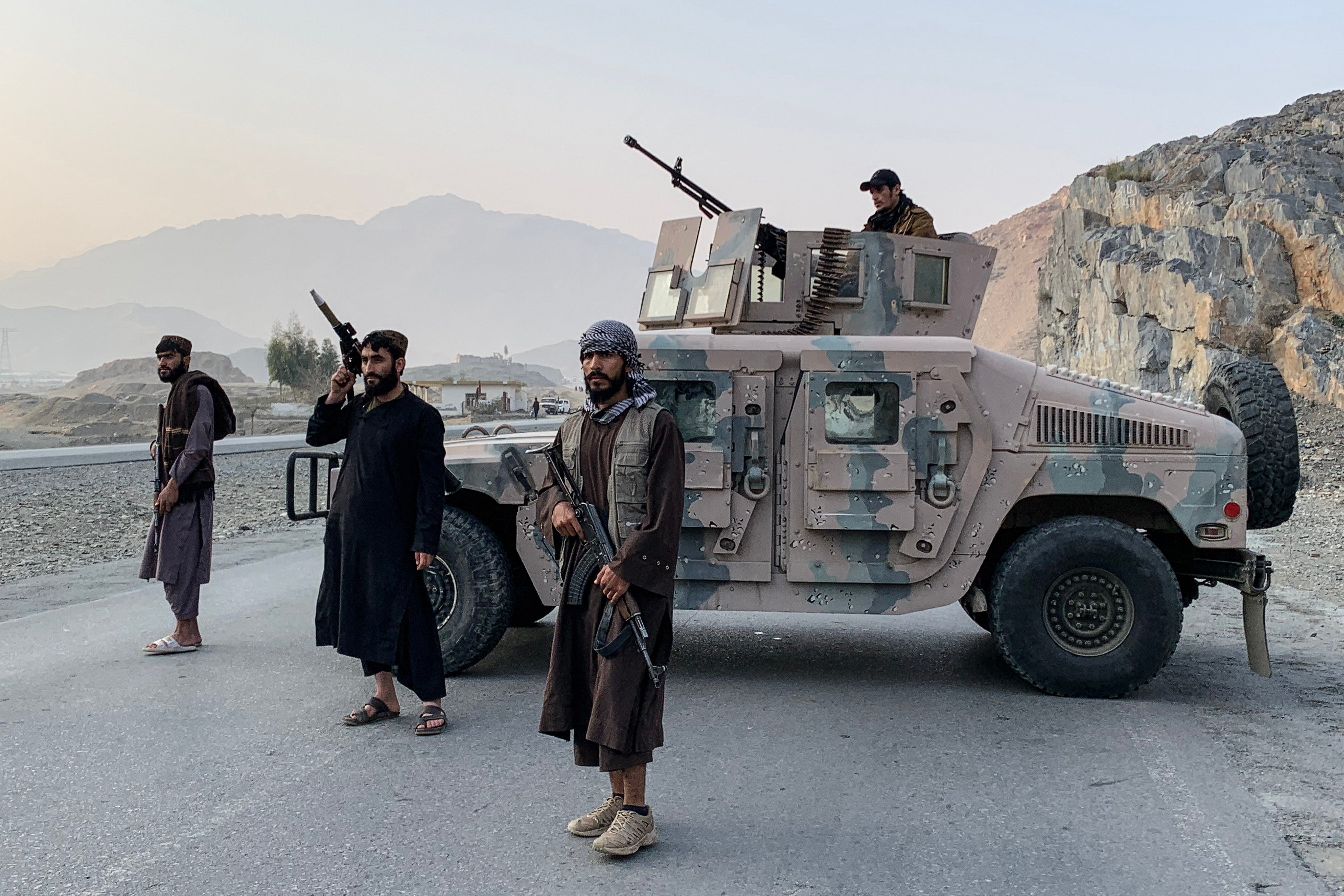 Taliban security personnel stand guard near the Torkham border crossing between Afghanistan and Pakistan in the Nangarhar province on February 27, 2026. Pakistan bombed major cities in Afghanistan including the capital Kabul on February 27, with Islamabad’s defence minister declaring the neighbours at “open war” following months of tit-for-tat clashes. AFP journalists in Kabul and Kandahar heard blasts and jets overhead, as Pakistan launched air strikes on the Afghan capital and southern power base of the Taliban authorities. (Photo by Aimal Zahir / AFP)