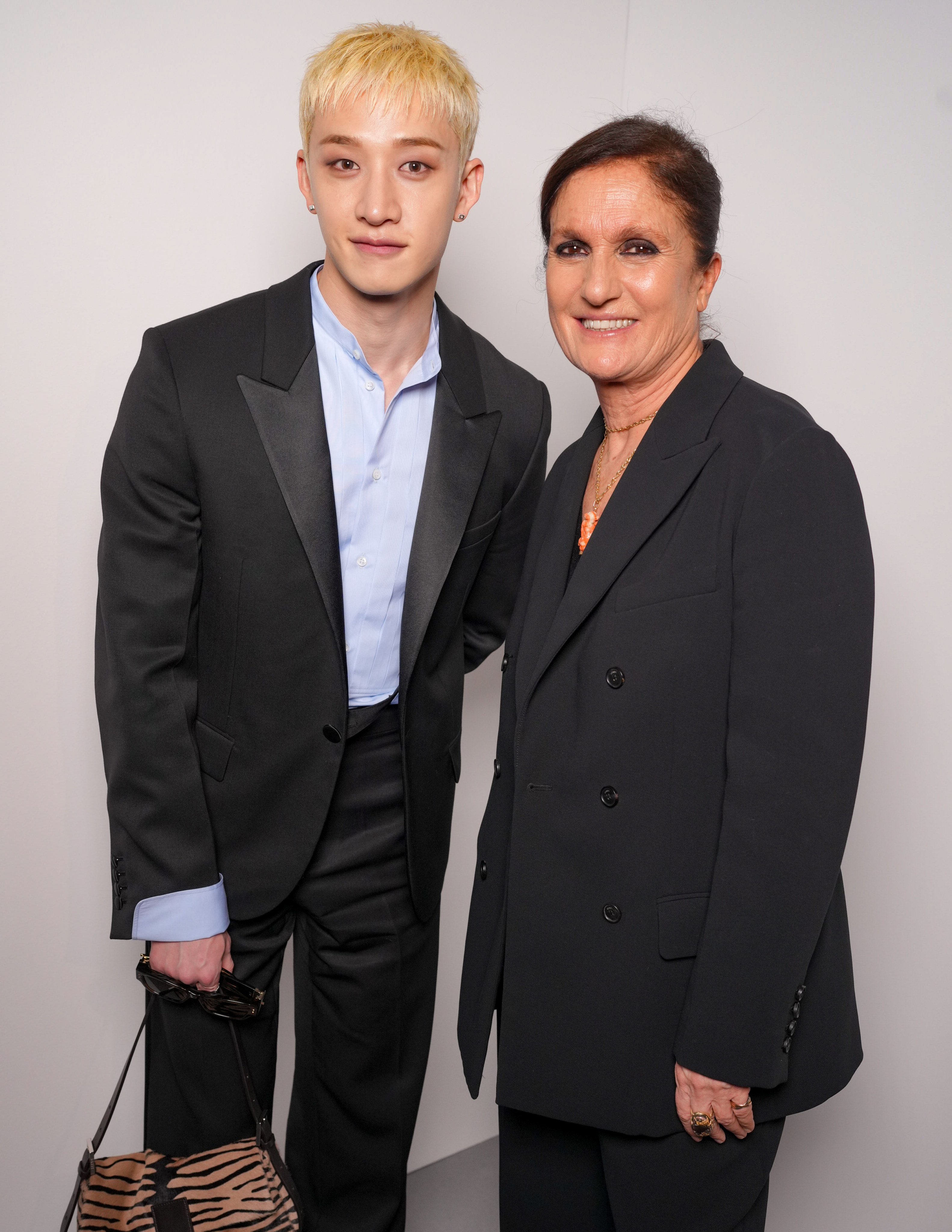 K-pop star Bang Chan and Fendi’s Maria Grazia Chiuri at the Fendi fall/winter 2026 show during Milan Fashion Week. Photo: Getty Images
