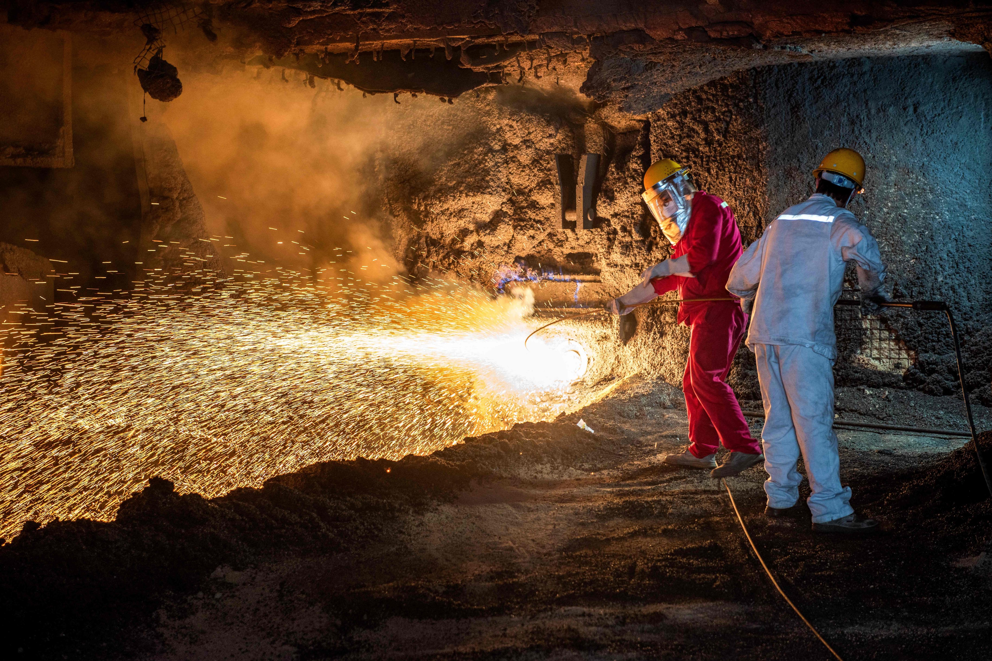 Molten steel sparks fly at a factory in Huaian, Jiangsu province. Photo: AFP