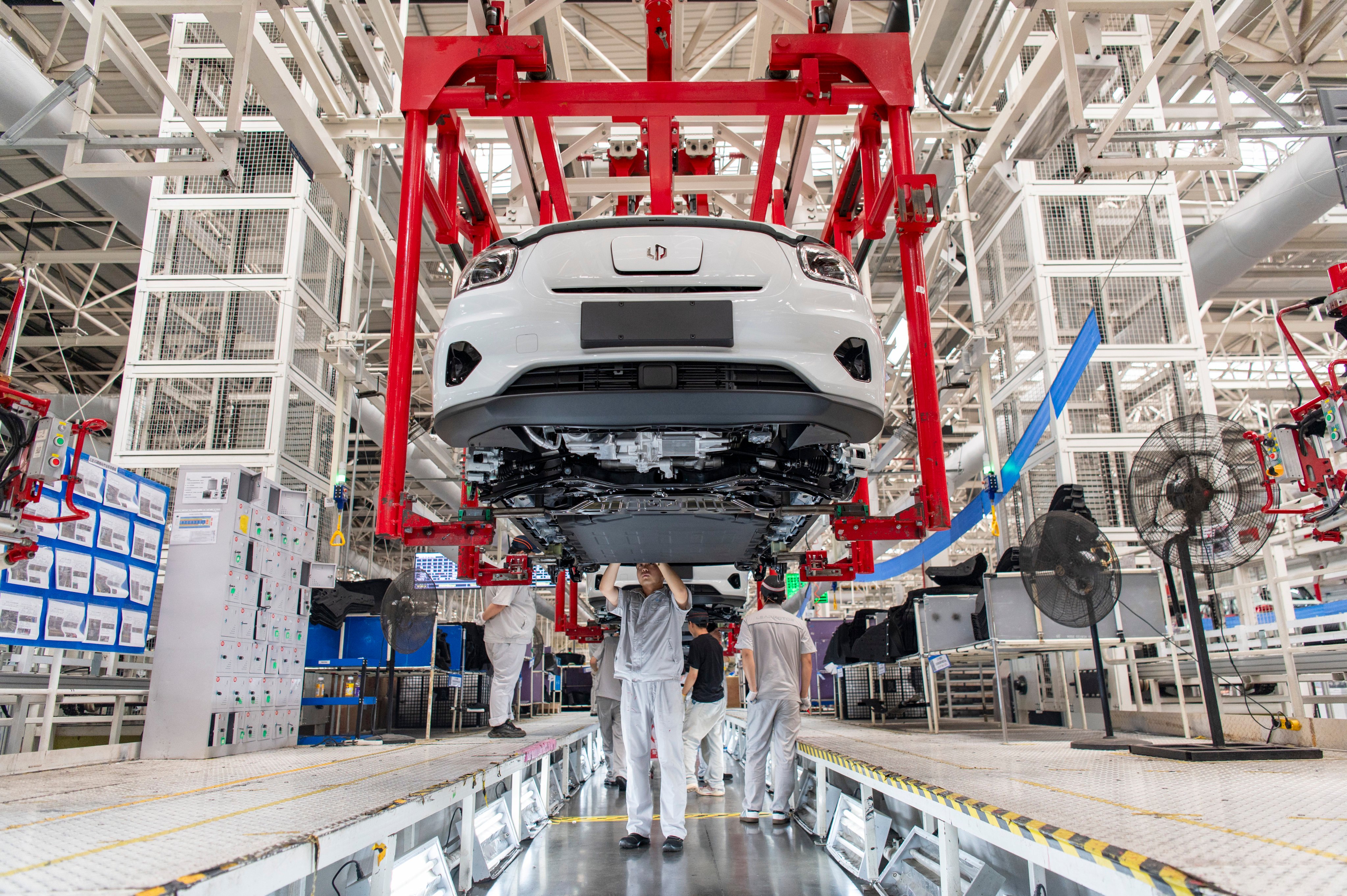Employees work on the assembly line of new energy vehicles at Zero Run’s plant in Jinhua, Zhejiang province. Photo: VCG via Getty Images
