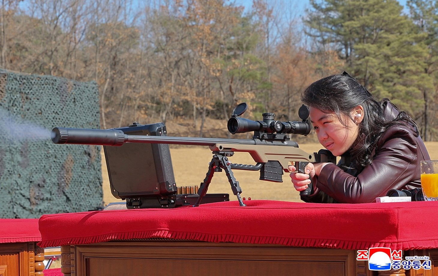 North Korean leader Kim Jong- un’s daughter, believed to be called Kim Ju-ae, firing a sniper rifle at a shooting range in North Korea on Friday. Photo: North Korean Central News Agency via EPA
