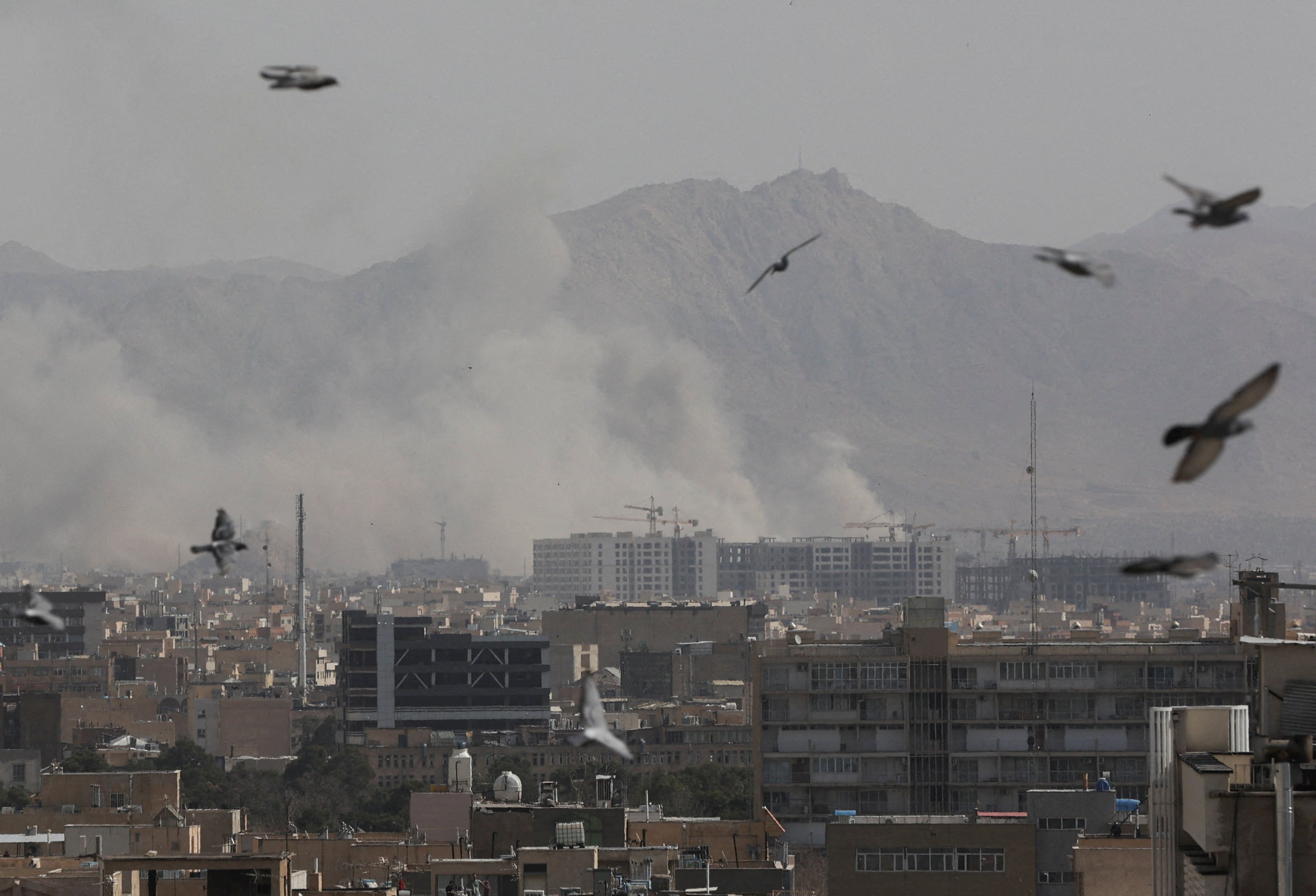 Smoke rises in Tehran after the US and Israel attacked Iran on Saturday. Photo: West Asia News Agency via Reuters