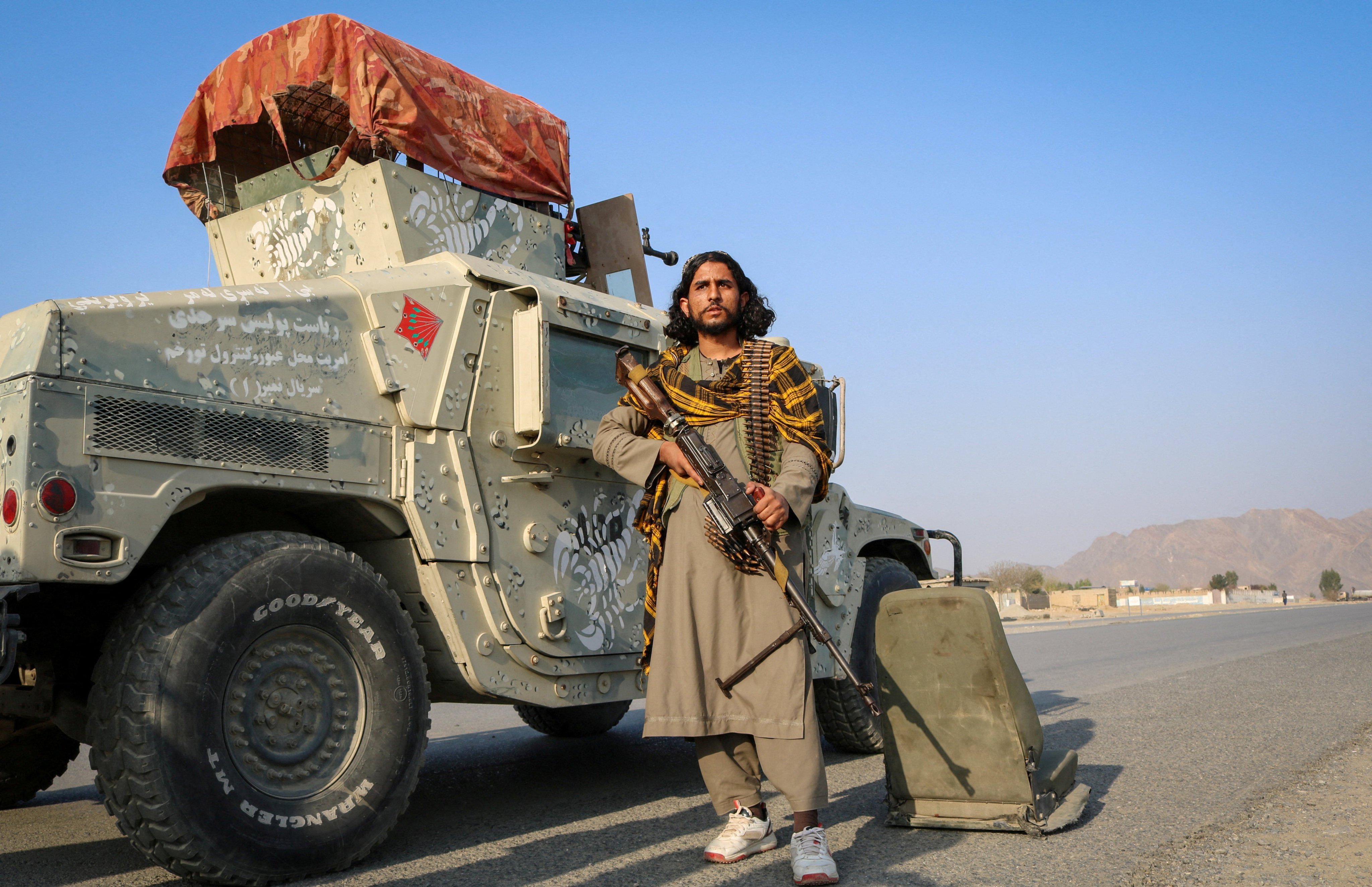 A Taliban fighter holds his weapon beside a Humvee after exchanges of fire between Pakistani and Afghan forces in Momand Dara district of Nangarhar province, Afghanistan, on Saturday. Photo: Reuters