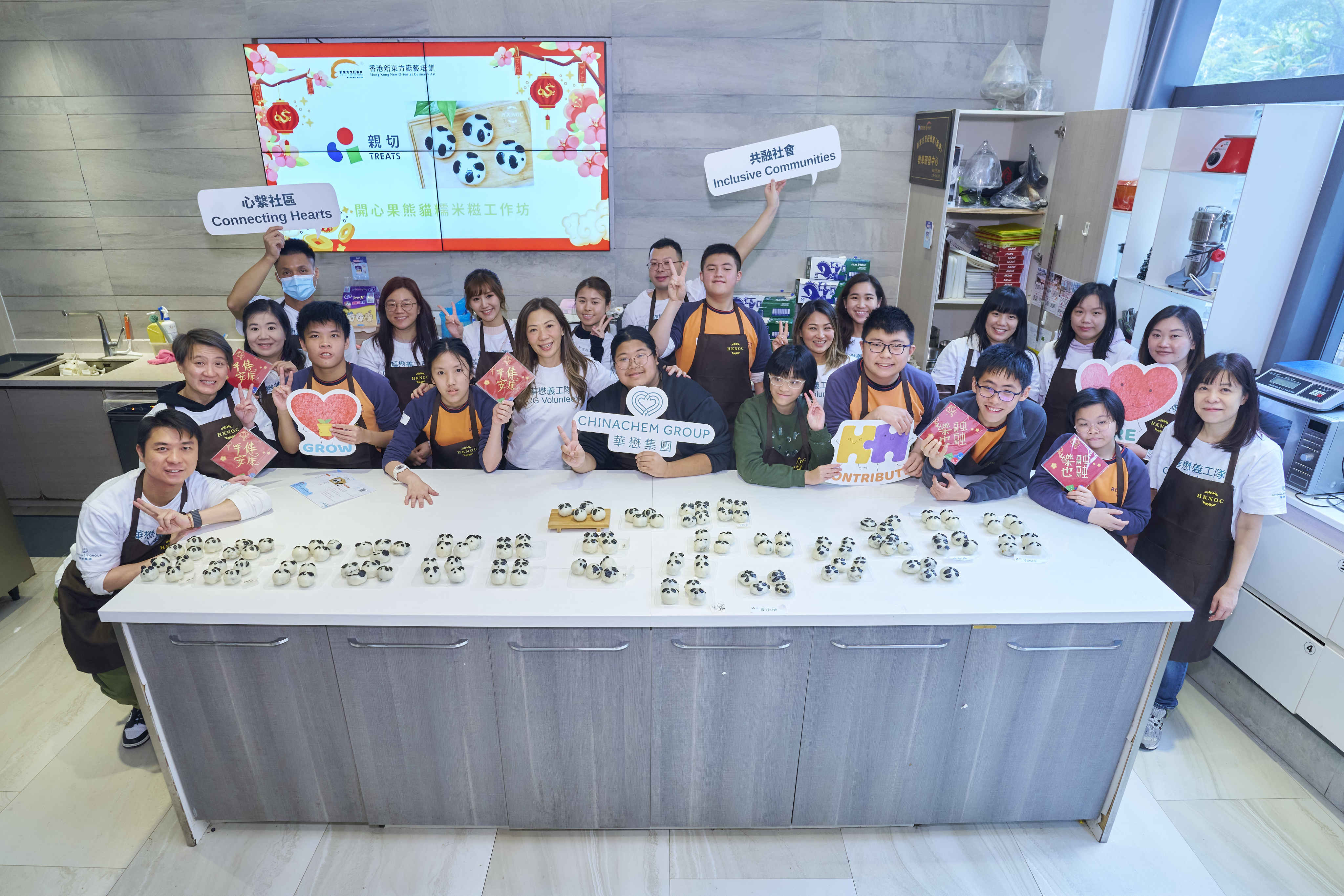 Participants decorate panda-themed mochi during the Chinachem Group and TREATS workshop for Operation Santa Claus. Photo: Wong Kin Fung
