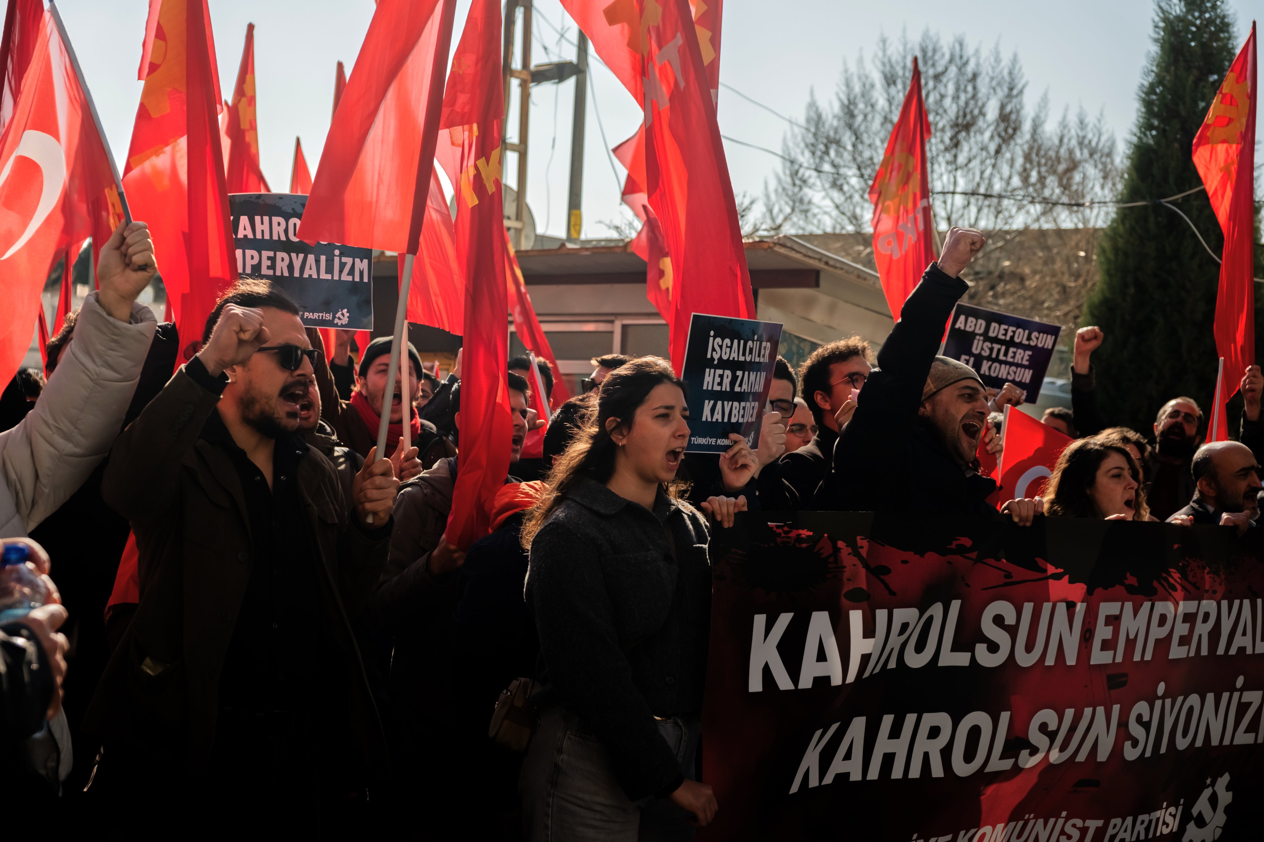 People chant slogans as they protest against US and Israeli strikes on Iran, outside a Nato base in Izmir, Turkey, on Saturday. Photo: AP