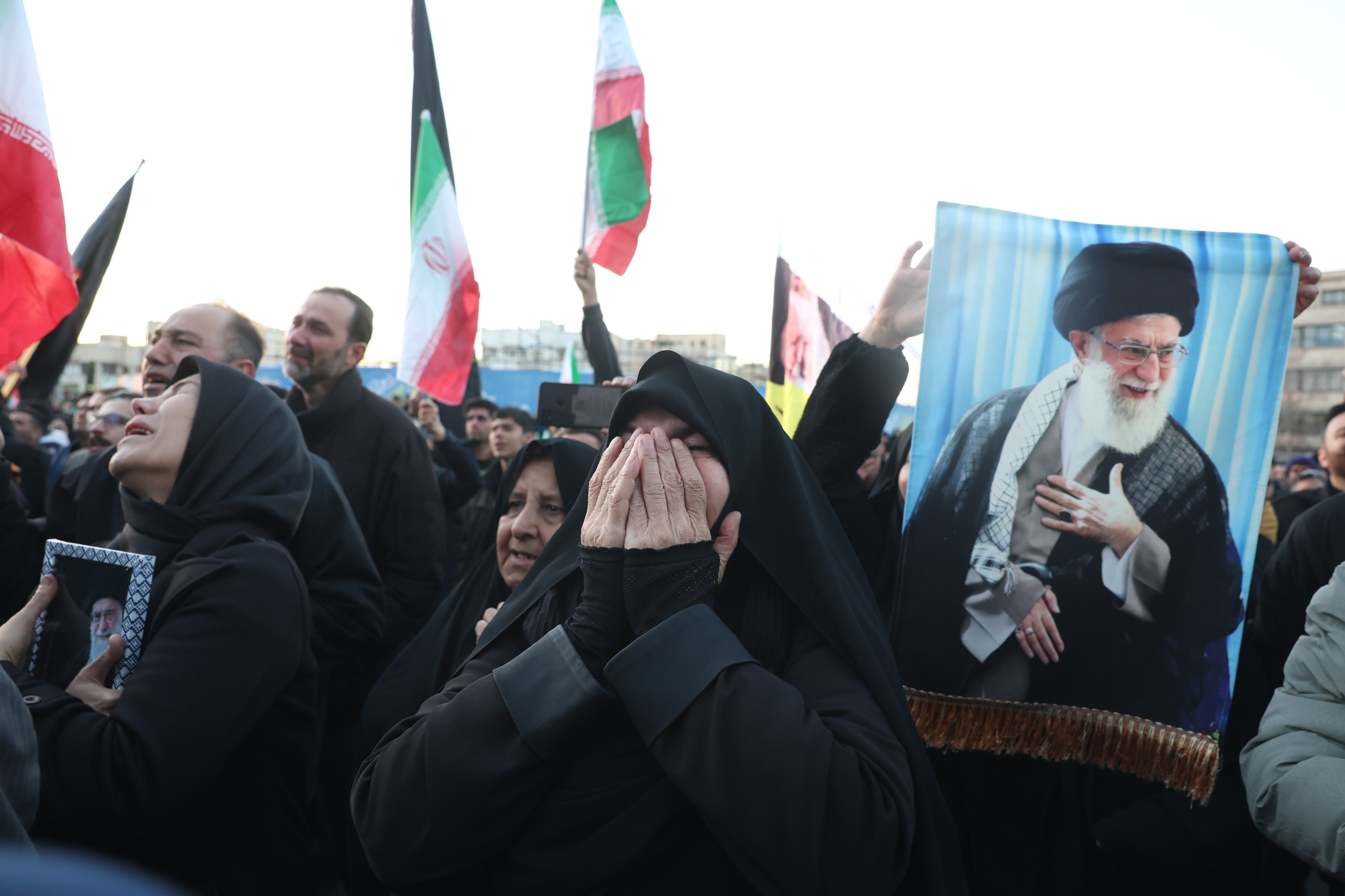 Mourners react following the death of Iranian Supreme leader Ayatollah Ali Khamenei in Tehran on Sunday. Photo: EPA