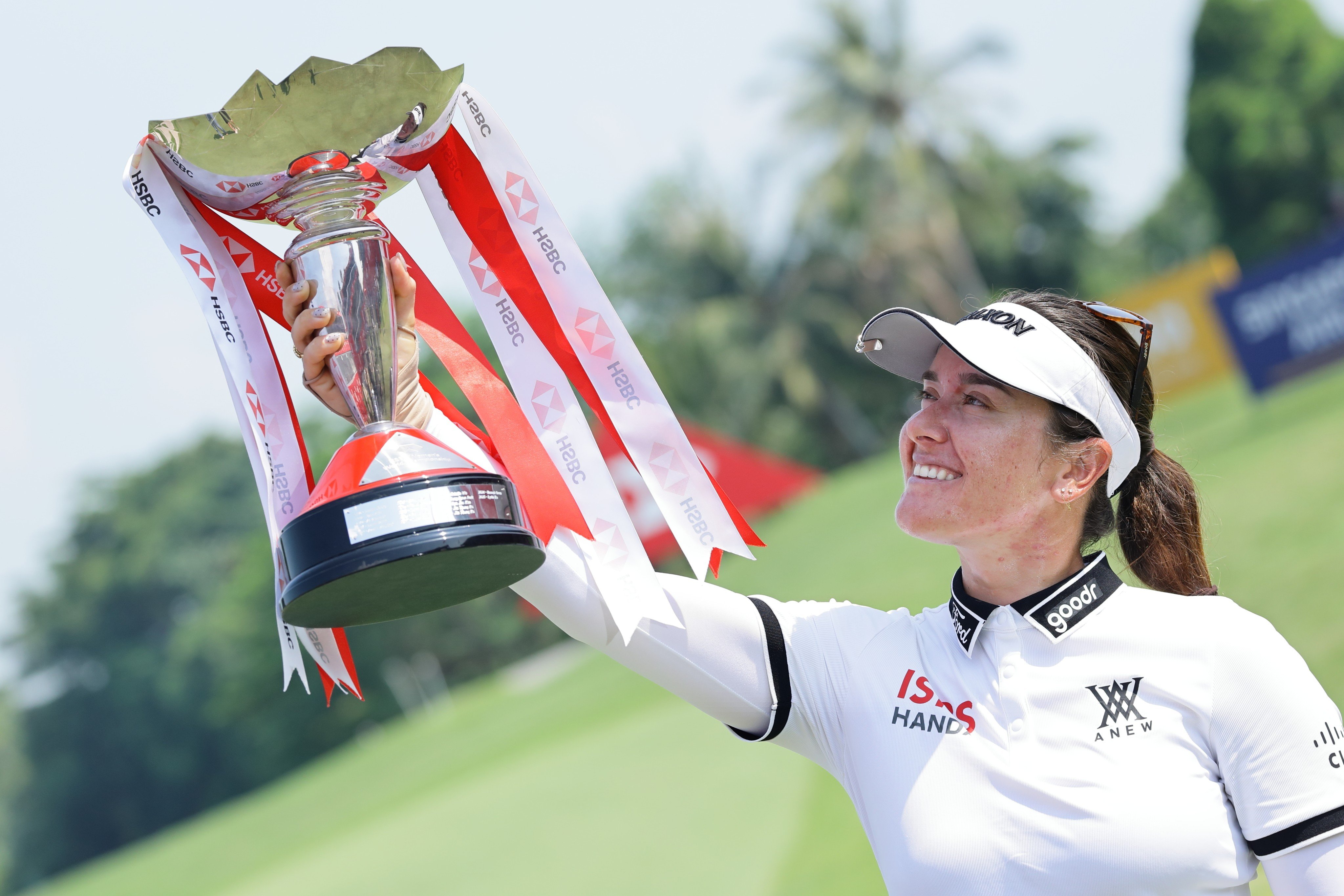 Hannah Green with the tournament trophy after winning the HSBC Women’s World Championship at Sentosa Golf Club in Singapore on Sunday. Photo: AP