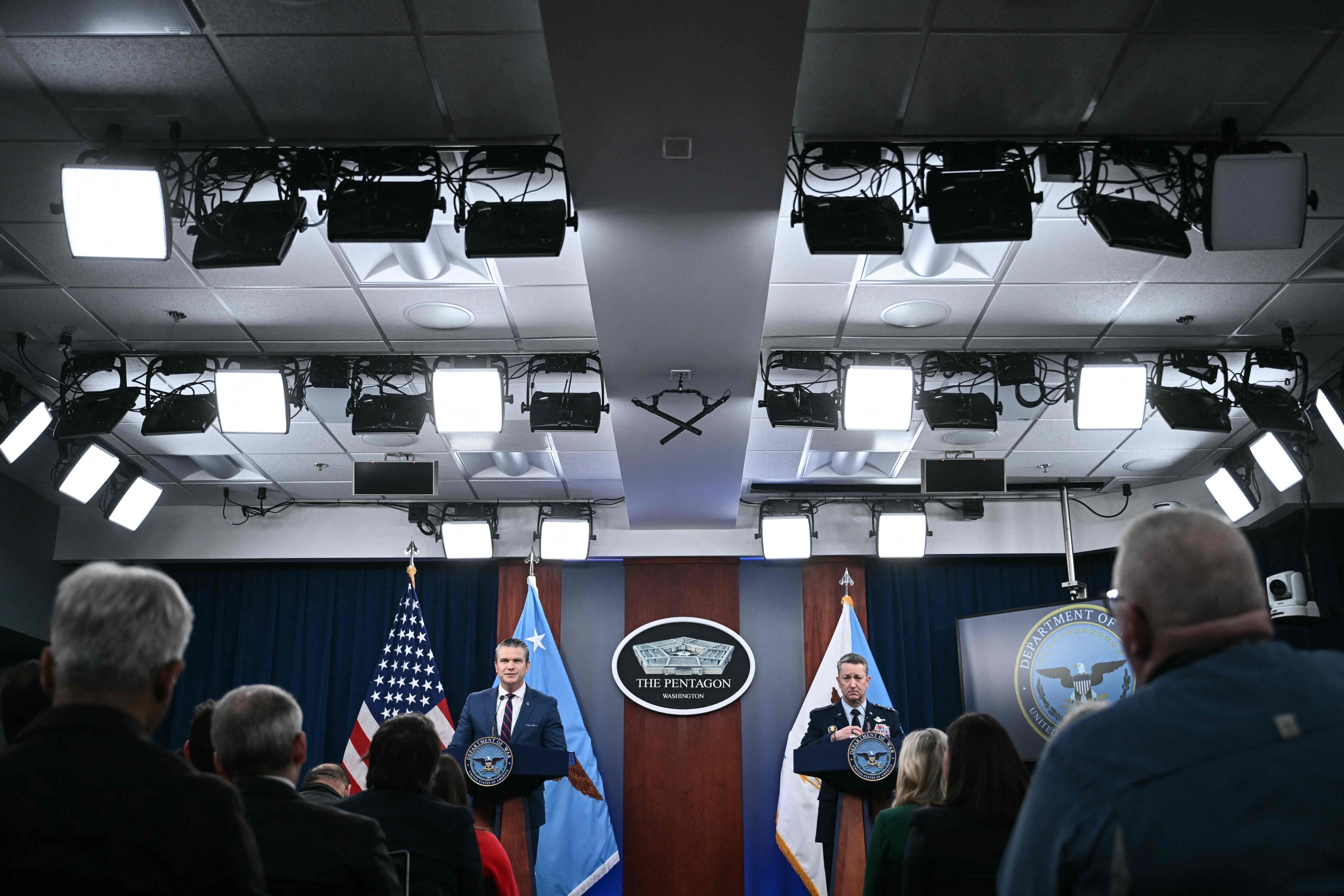 US Secretary of Defence Pete Hegseth and Chairman of the Joint Chiefs of Staff General Dan Caine speak at the Pentagon in Virginia on Monday. Photo: AFP